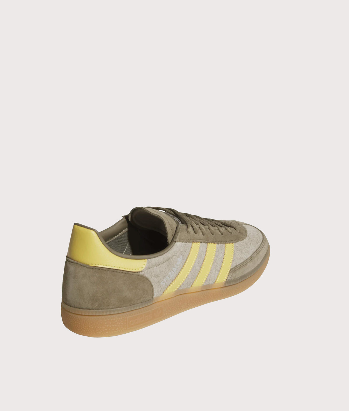 adidas Originals Handball Spezial Trainers  in Olive Strata, Pyrite and Gum 4 at EQVVS Menswear. Angled back shot.