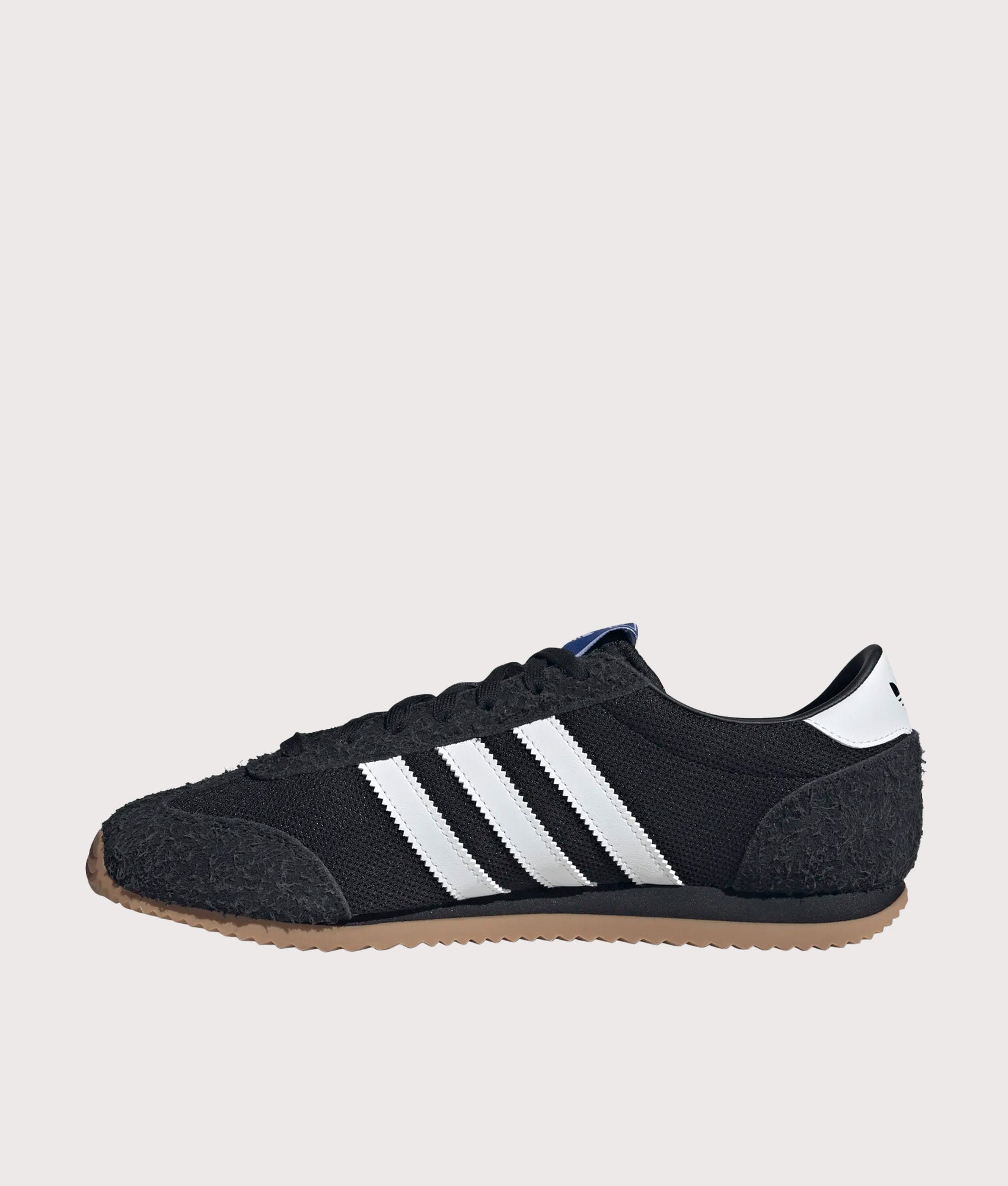 adidas Originals 1609ER RS Trainers in Core Black, Footwear White and Gold Metallic at EQVVS Menswear. Side shot.