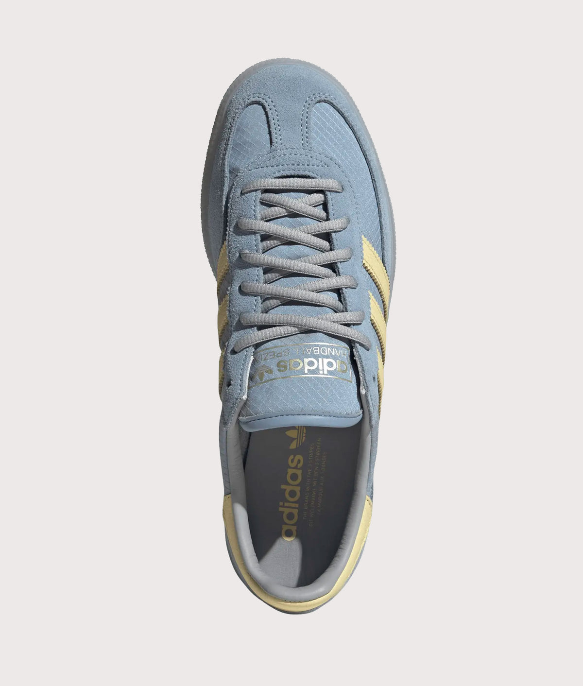 adidas Originals Handball Spezial Trainers  in Ambient Sky, Almost Yellow and Clear Grey at EQVVS Menswear. Top shot.