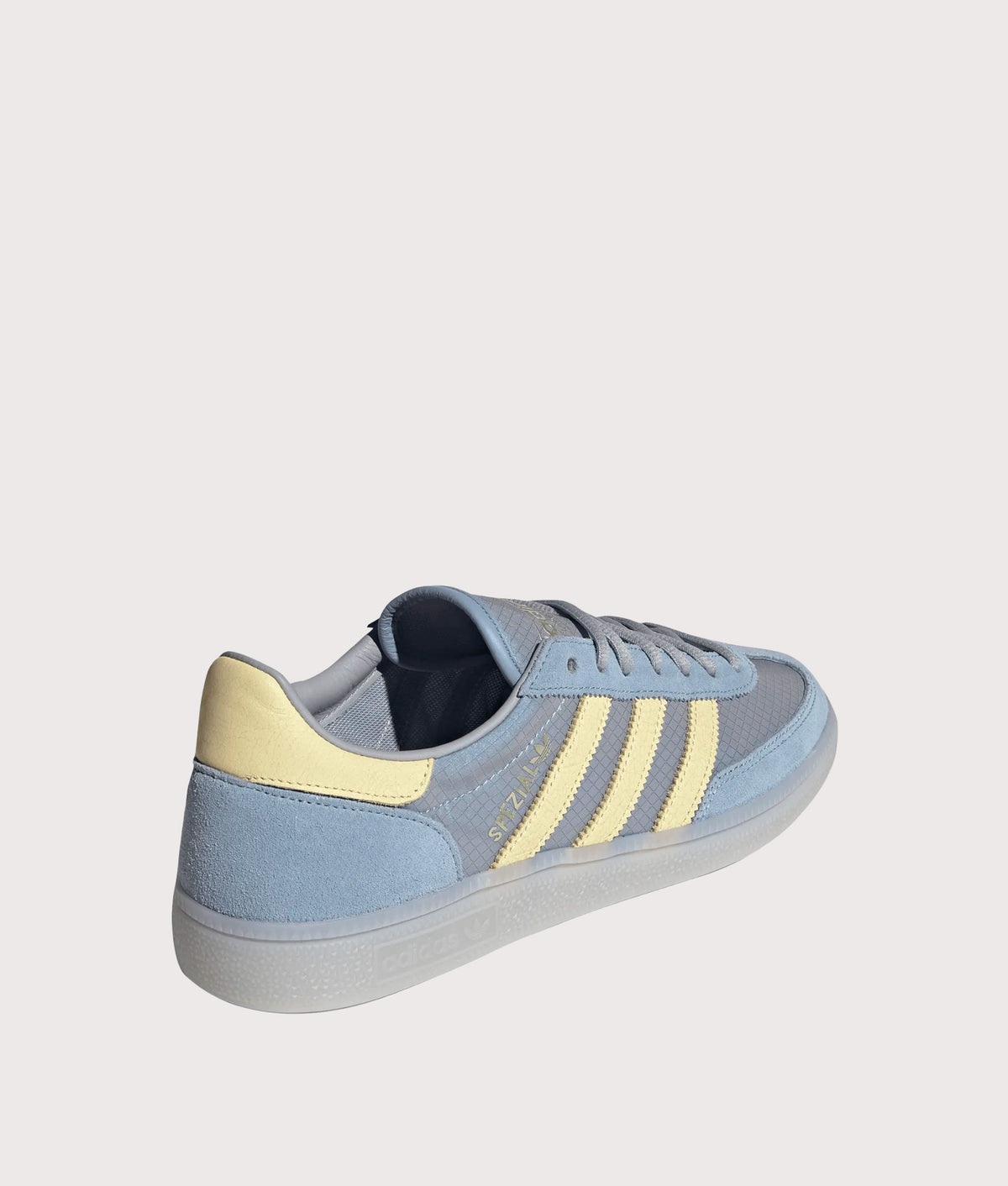 adidas Originals Handball Spezial Trainers  in Ambient Sky, Almost Yellow and Clear Grey at EQVVS Menswear. Angled back shot.