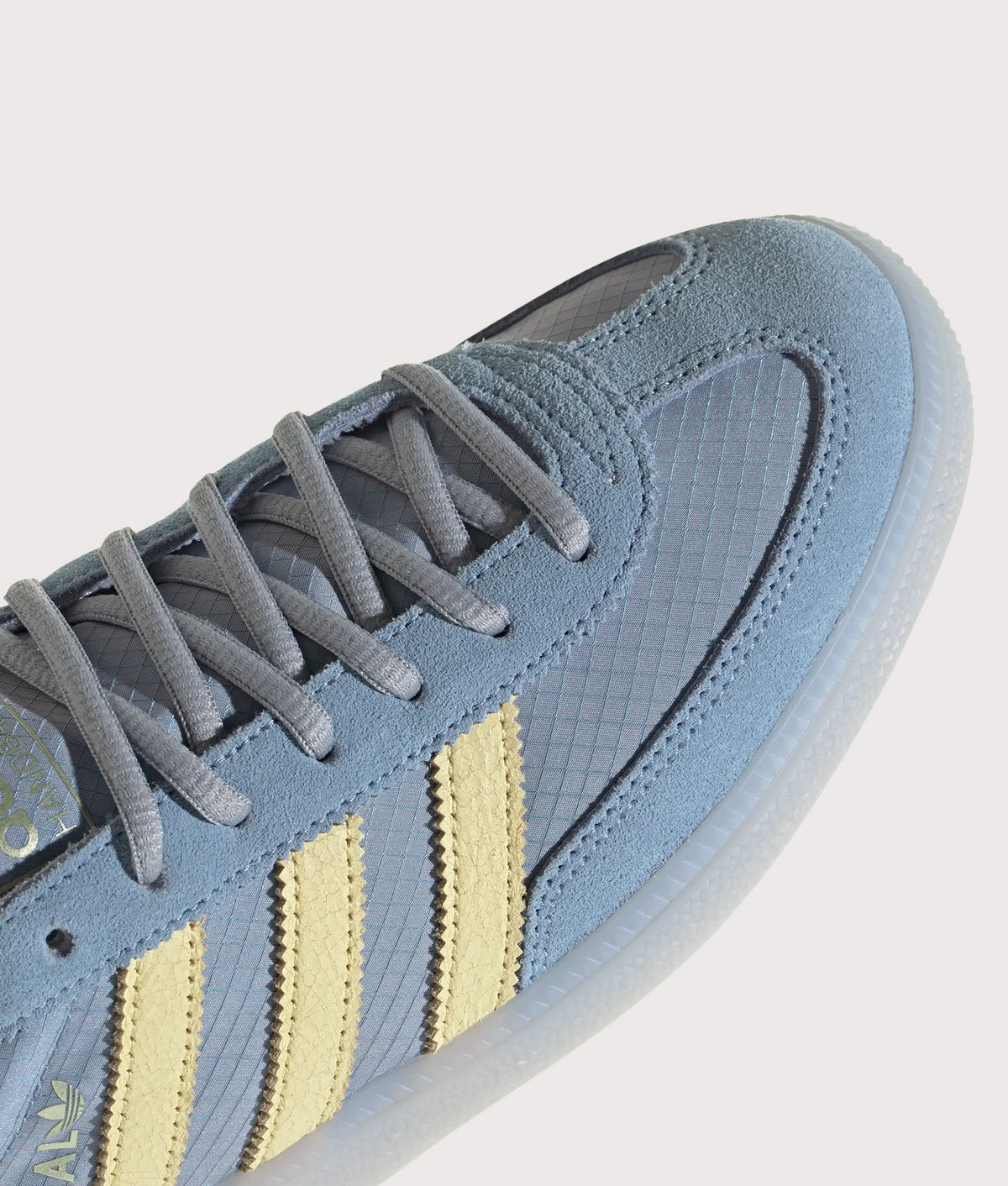adidas Originals Handball Spezial Trainers  in Ambient Sky, Almost Yellow and Clear Grey at EQVVS Menswear. Detail shot.