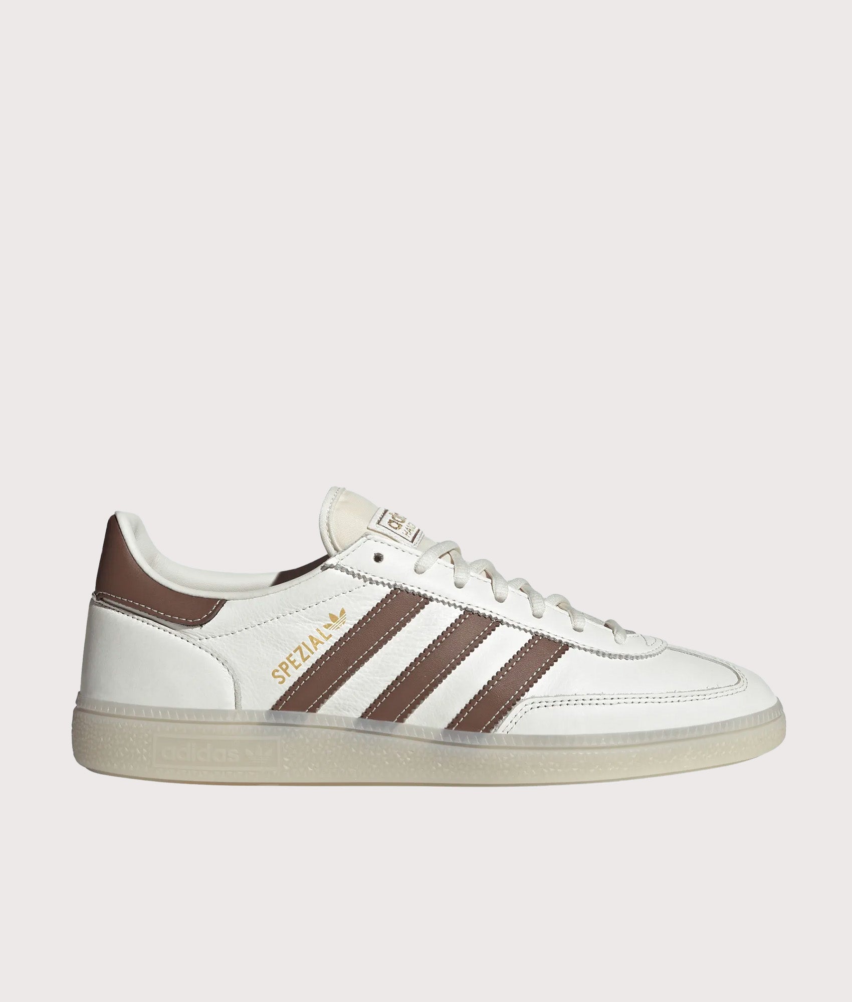 adidas Originals Handball Spezial Trainers in Core White, Preloved Brown and Off White at EQVVS Menswear. Side shot.