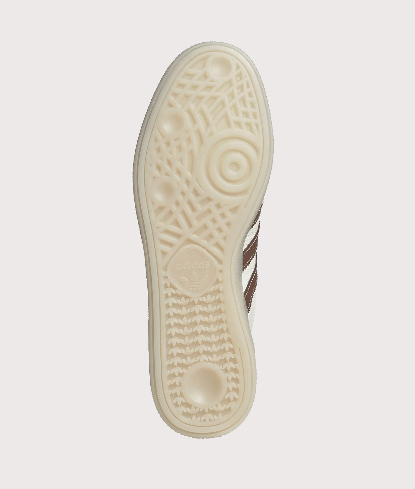 adidas Originals Handball Spezial Trainers in Core White, Preloved Brown and Off White at EQVVS Menswear. Tread shot.