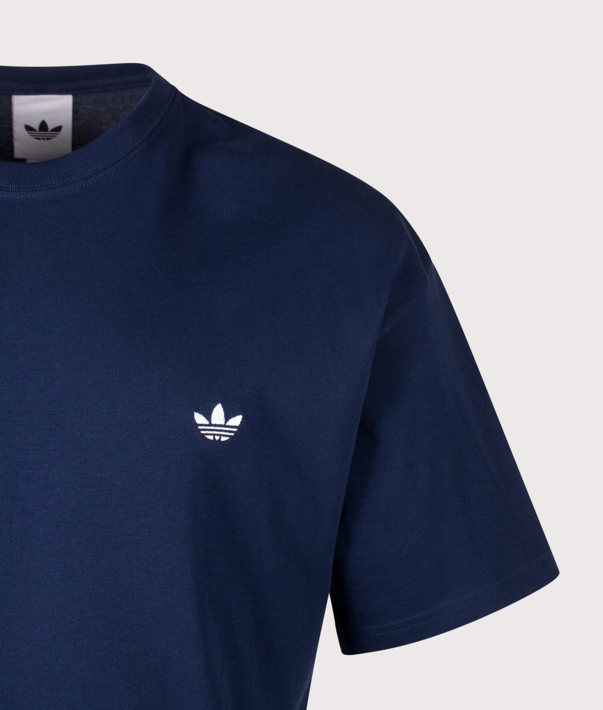 adidas Originals Loose Fit Trefoil Essentials T-Shirt in Night Indigo at EQVVS Menswear. Detail shot.