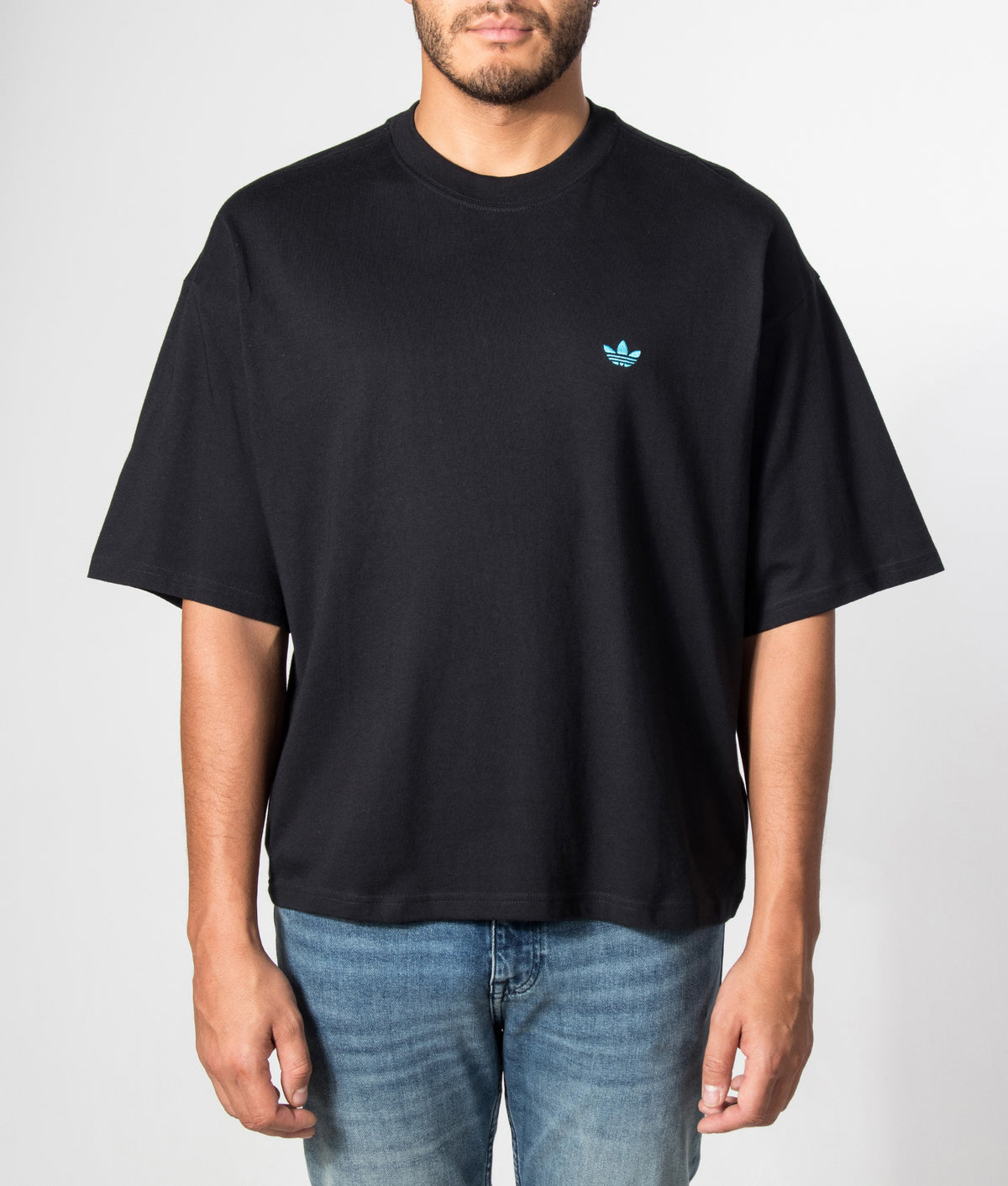 adidas Originals Oversized Trefoil Essentials T-Shirt in Black and Samba Blue at EQVVS Menswear. Model front shot.