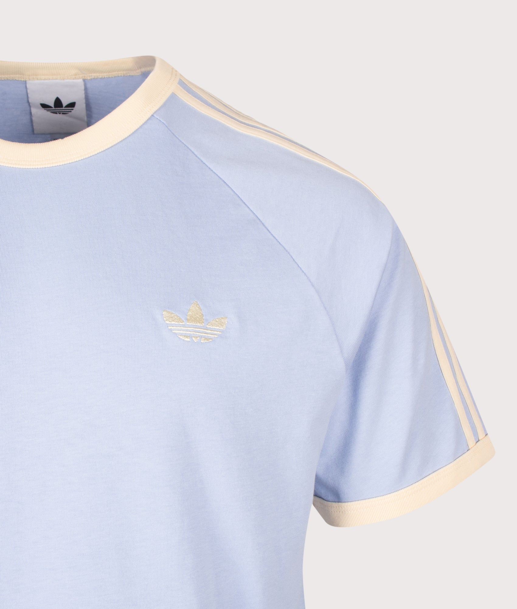 adidas Originals 3 Stripes T-Shirt in Blue Dawn and Warm Vanilla at EQVVS Menswear. Detail shot.