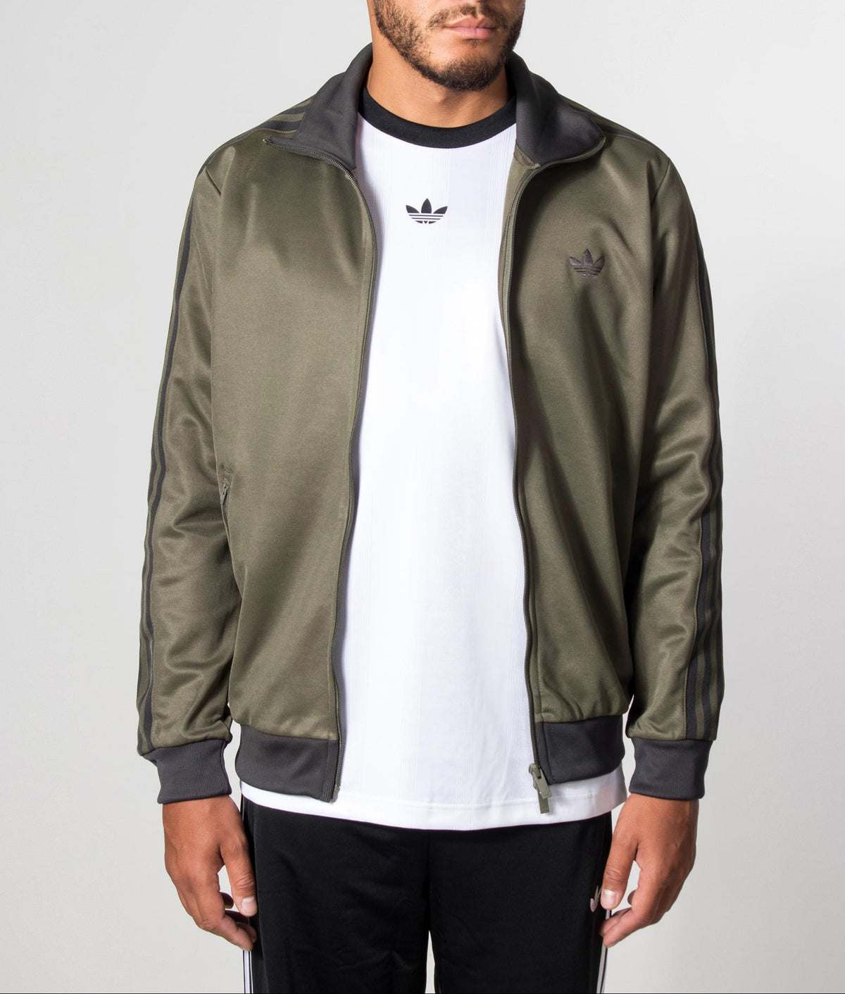 adidas Originals Beckenbauer Classic Track Top in Branch at EQVVS Menswear. Model front shot.
