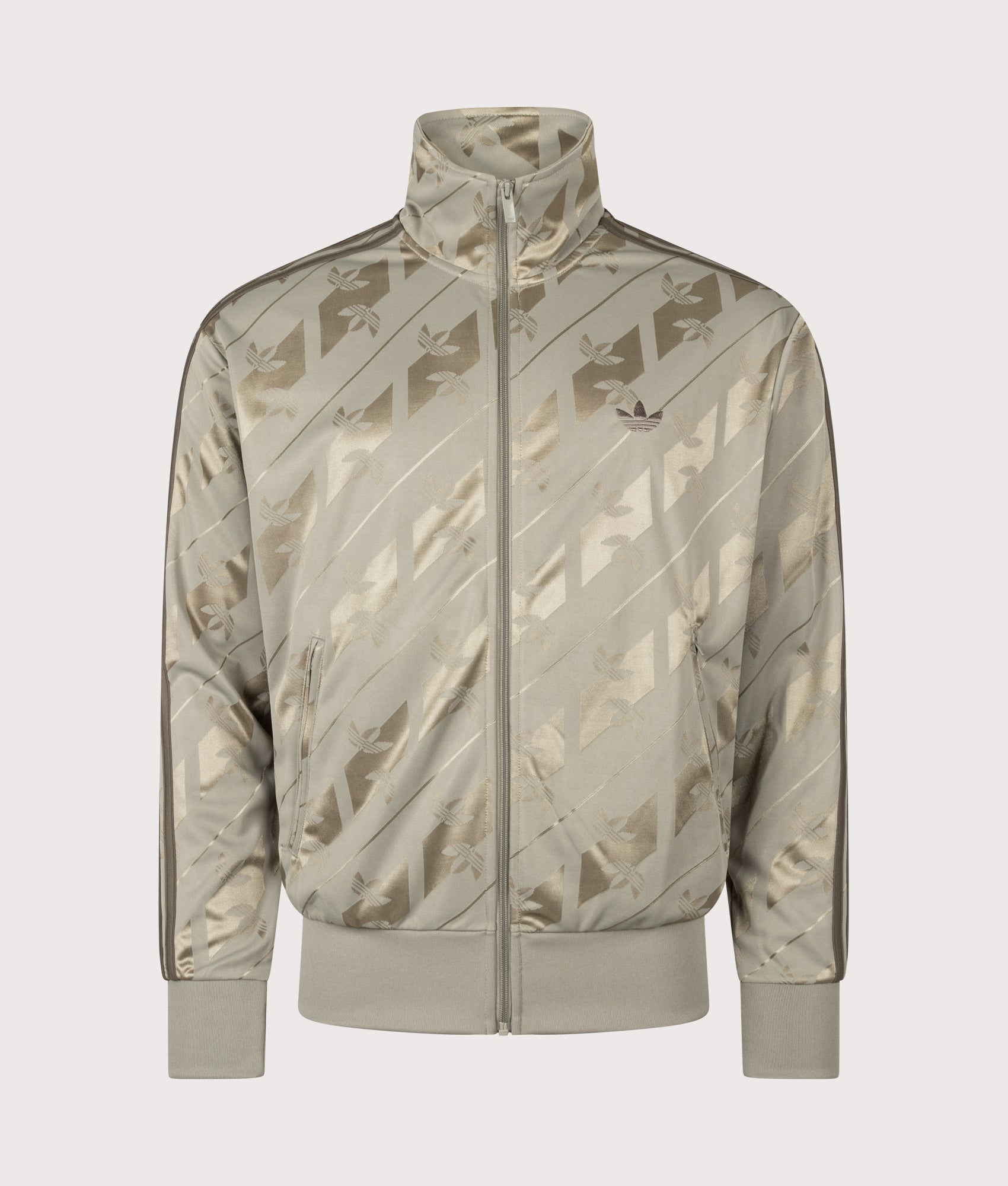 adidas Originals Loose Fit Firebird Monogram Track Top in Silver Pebble at EQVVS Menswear. Front shot.