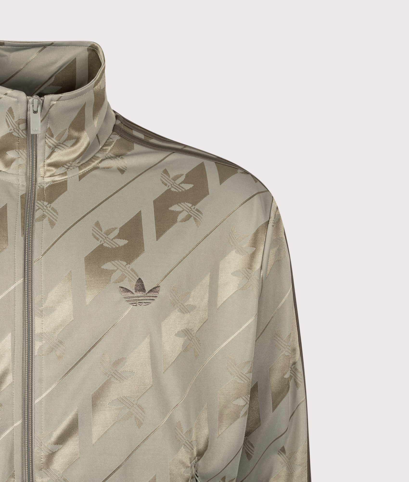 adidas Originals Loose Fit Firebird Monogram Track Top in Silver Pebble at EQVVS Menswear. Detail shot.