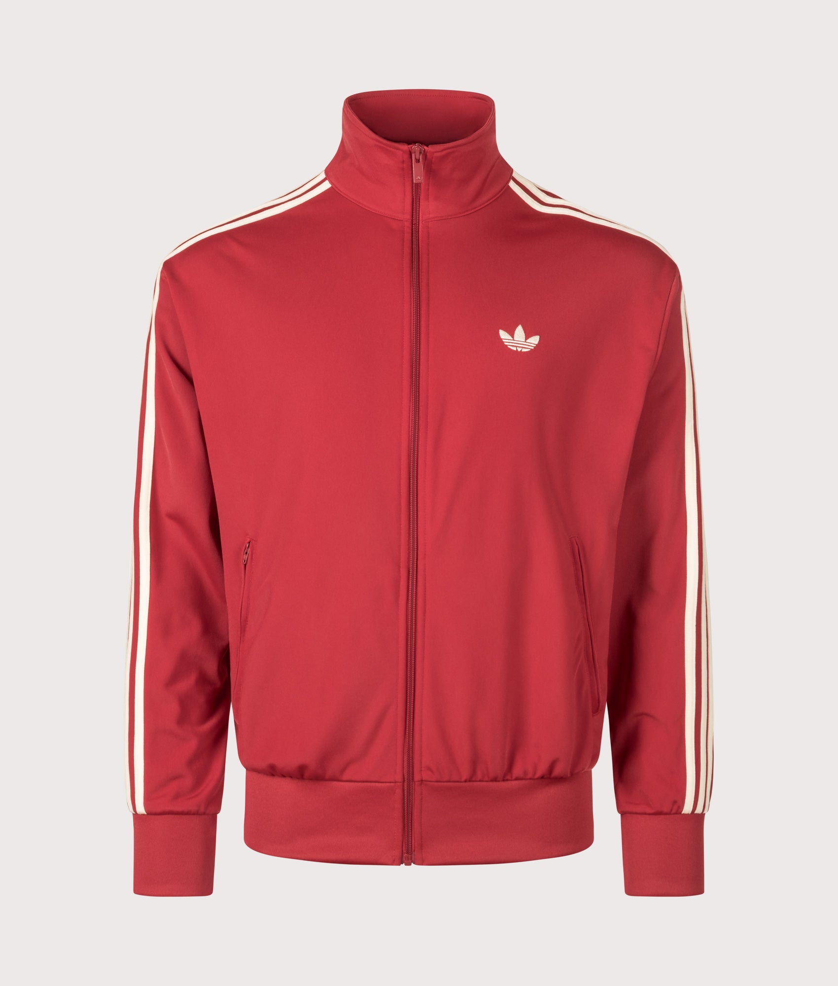 adidas Originals Loose Fit Firebird Track Top in Team Victory Red and Warm Vanilla at EQVVS Menswear. Front shot.