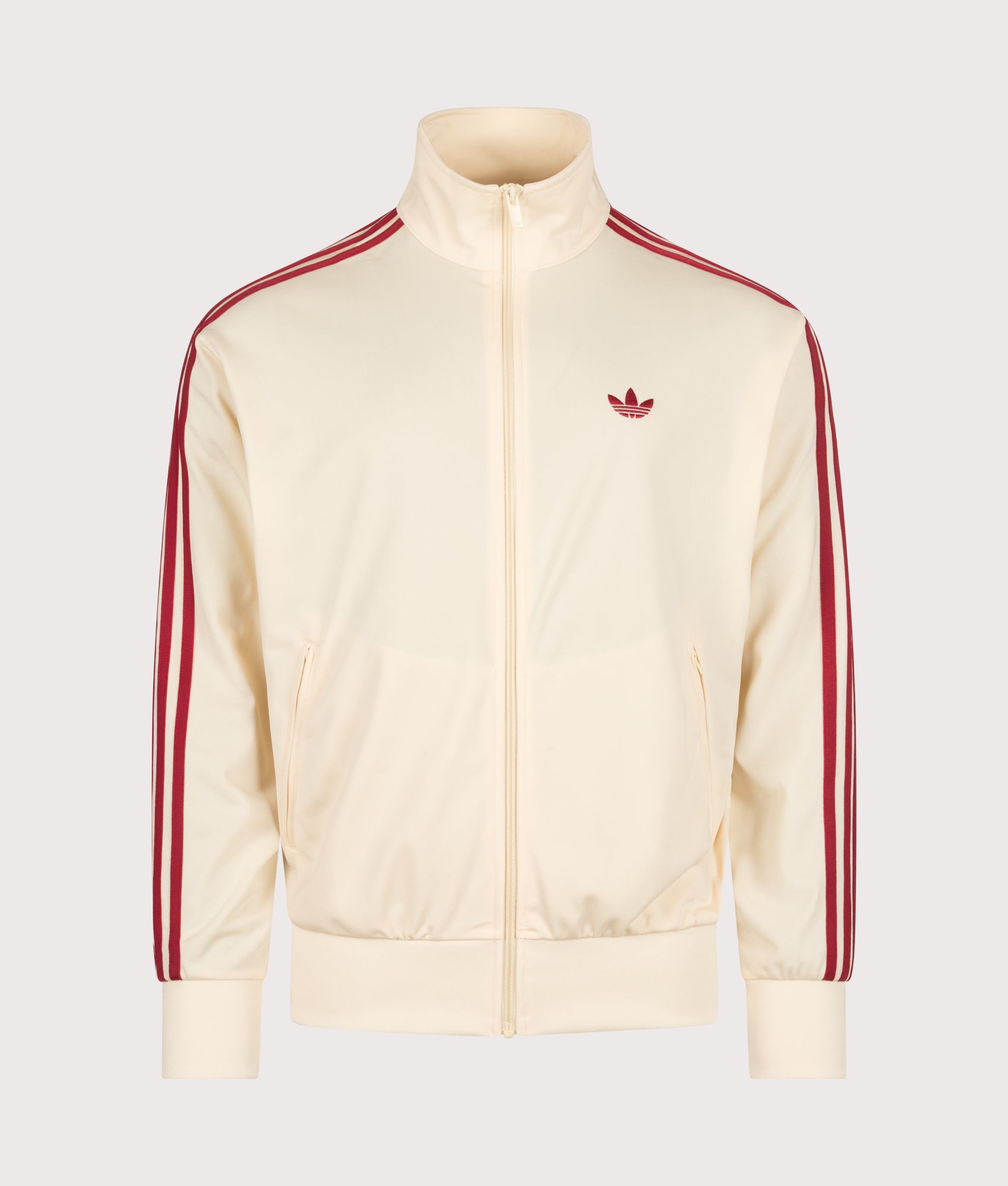 adidas Originals Loose Fit Firebird Track  in Warm Vanilla and Team Victory Red at EQVVS Menswear. Front shot.