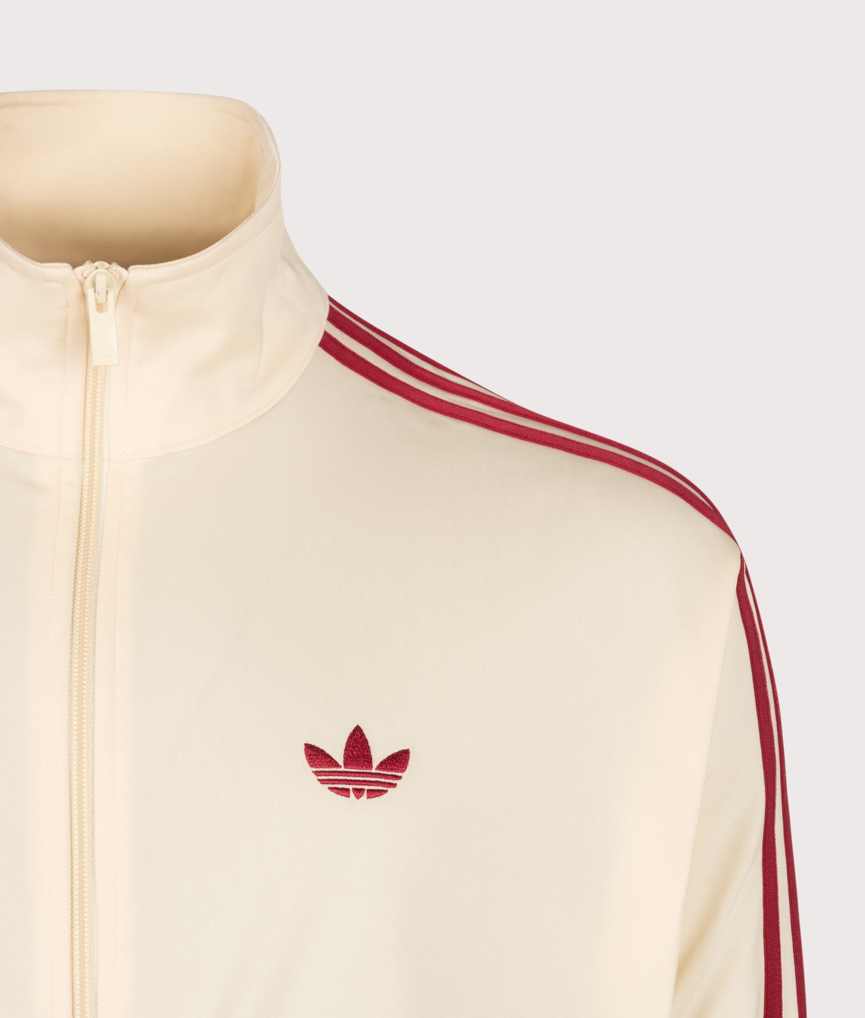 adidas Originals Loose Fit Firebird Track  in Warm Vanilla and Team Victory Red at EQVVS Menswear. Detail shot.