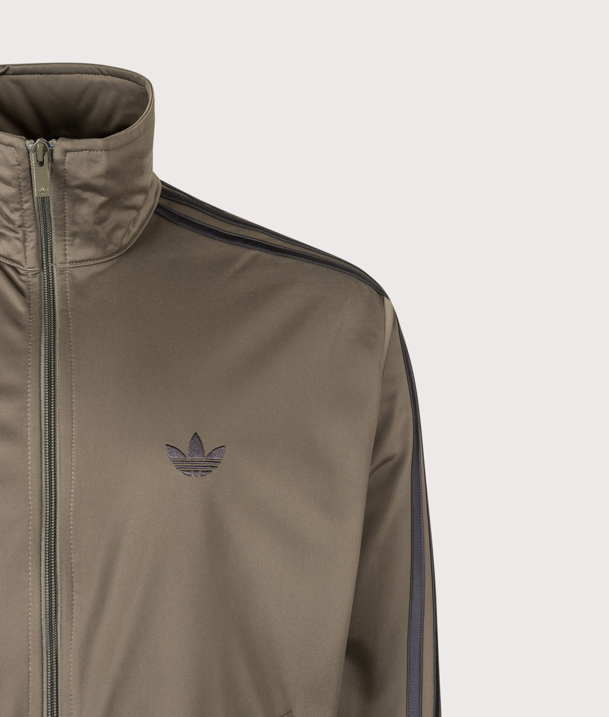 adidas Originals Loose Fit Firebird Track Top in Branch at EQVVS Menswear. Detail shot.