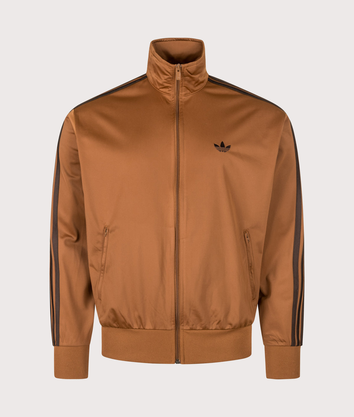 adidas Originals Loose Fit Firebird Track Top in Dusky Bronze and Aurora Coffee at EQVVS Menswear. Front shot.