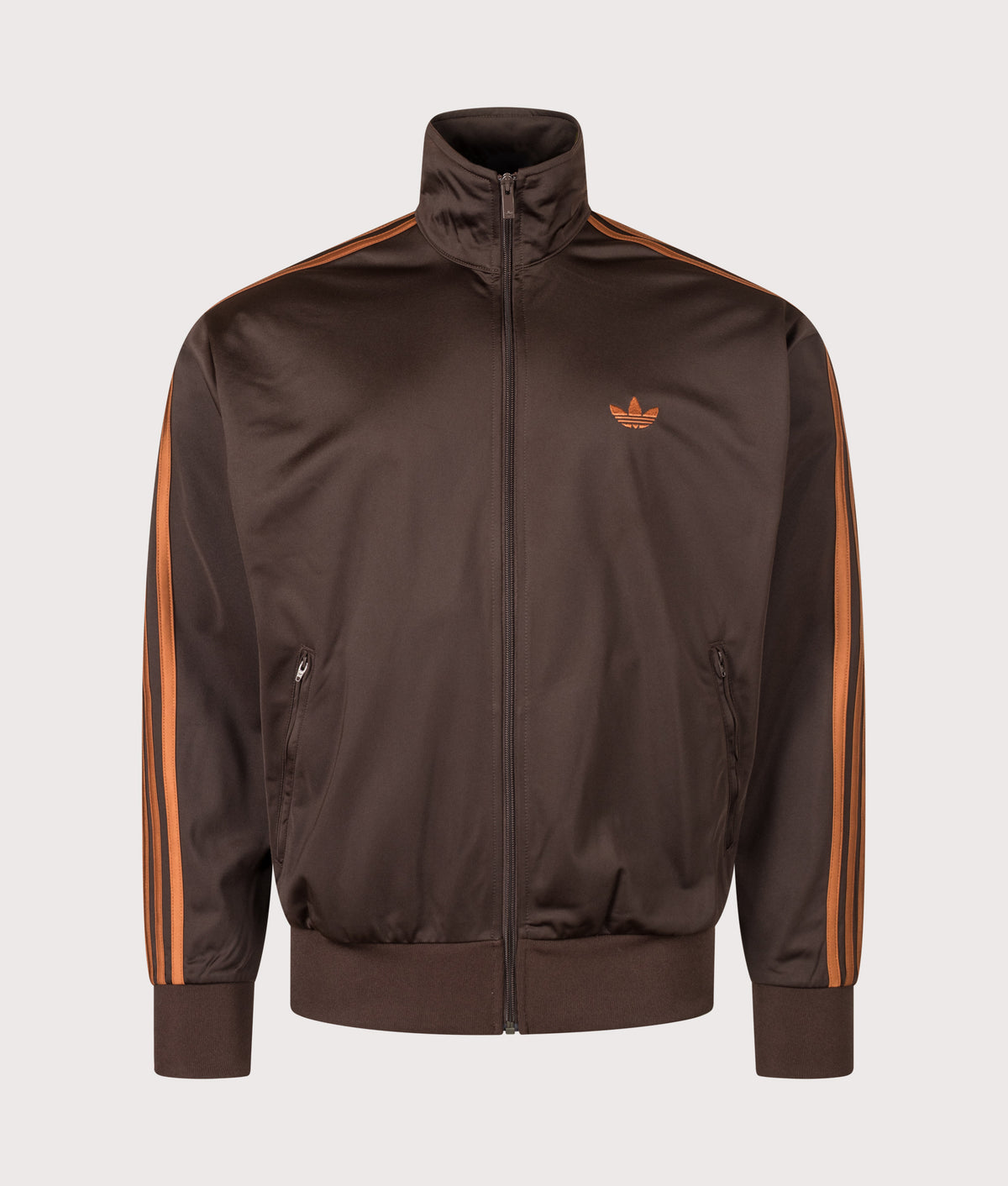 adidas Originals Loose Fit Firebird Track Top in Aurora Coffee and Dusky Bronze at EQVVS Menswear. Front shot.