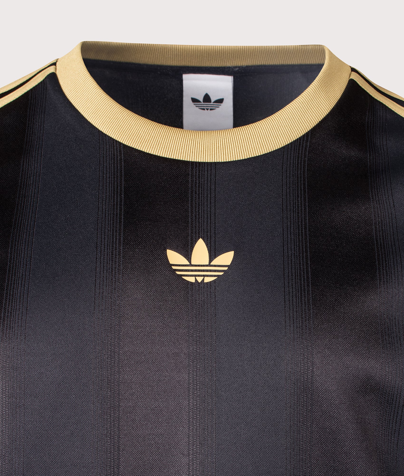 adidas Originals Oversized Fit Adicolour Jacquard Jersey T-Shirt in Black and Dark Football Gold at EQVVS Menswear.  Details shot.