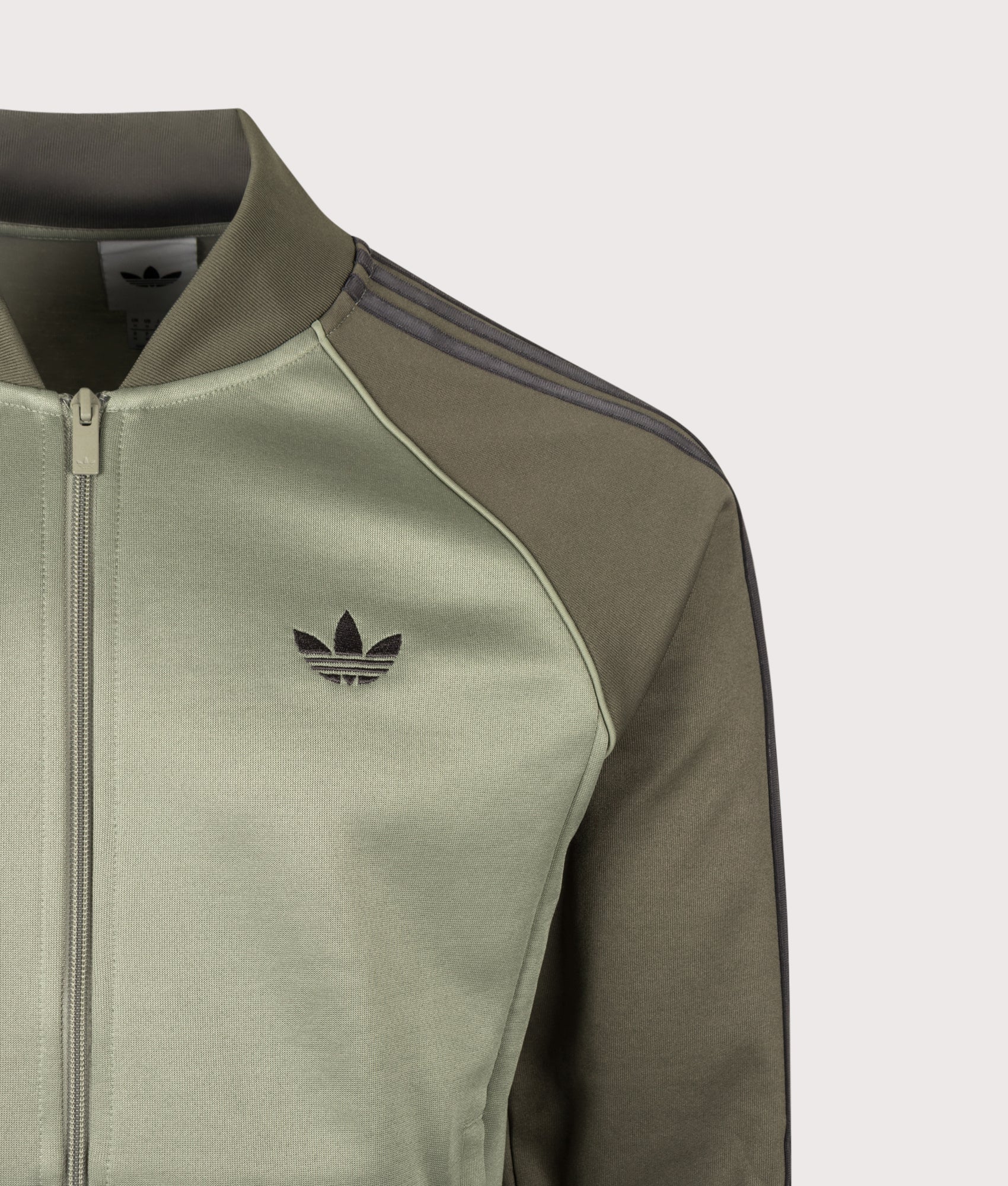 adidas Originals SST Track Top in Silver Pebble at EQVVS Menswear. Detail shot.