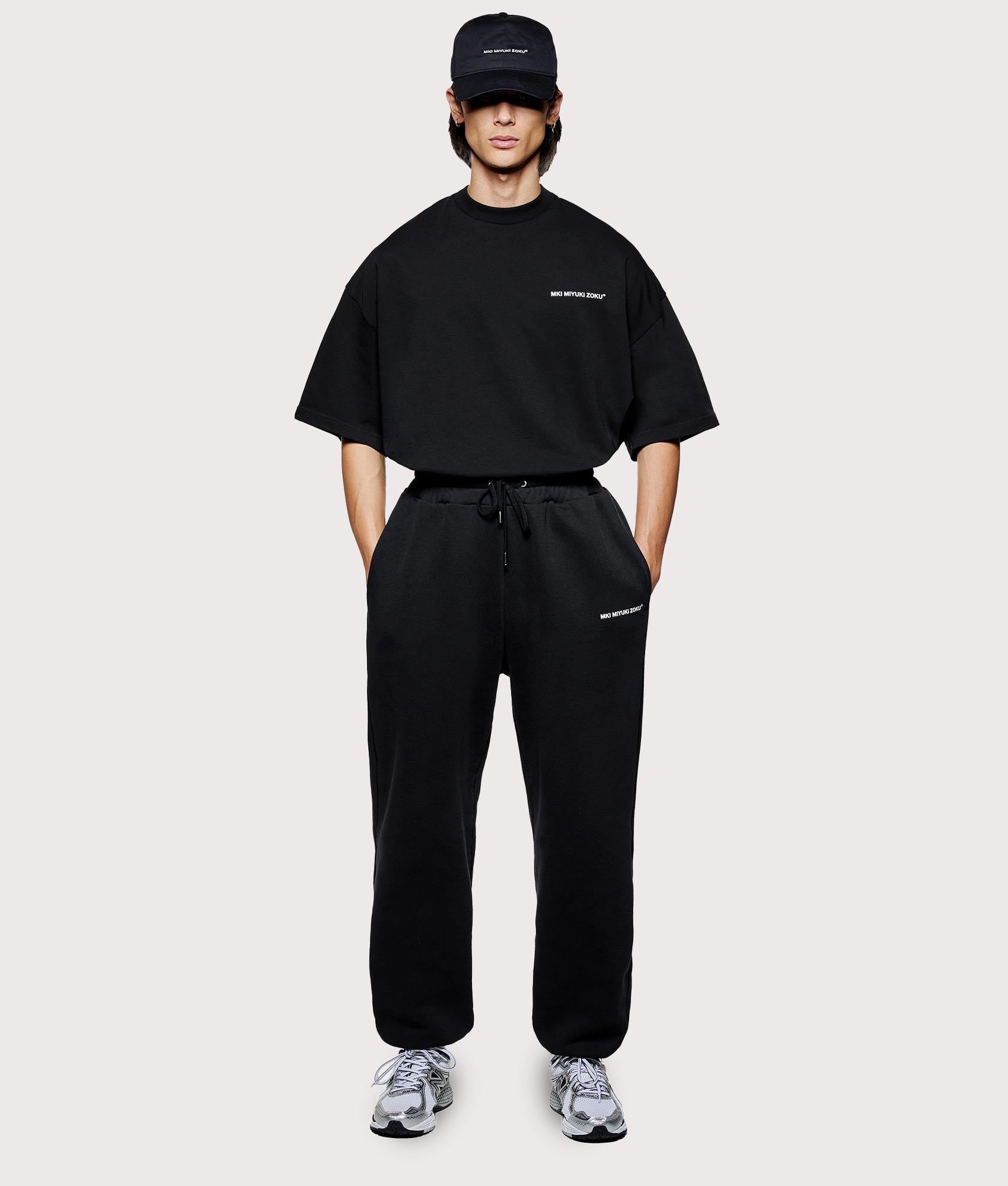 MKI Miyuki Zoku Uniform Joggers in black at EQVVS Menswear. Model front shot.