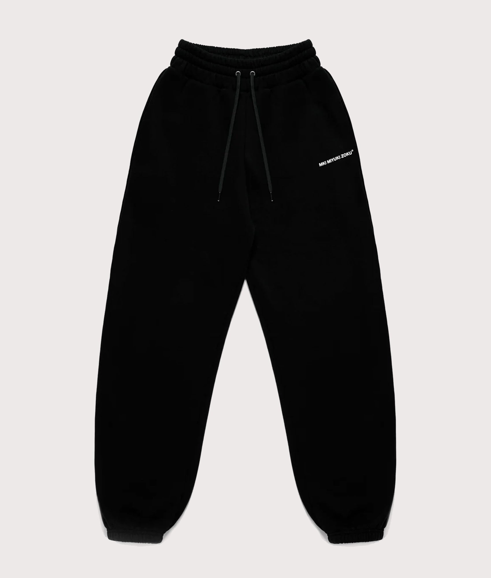 MKI Miyuki Zoku Uniform Joggers in black at EQVVS Menswear. Front shot.