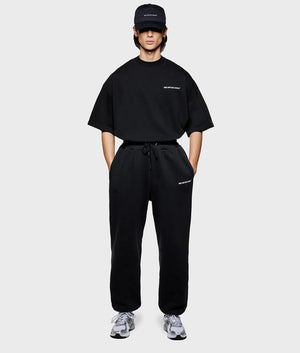 MKI Relaxed Fit Uniform Joggers in black. Front model shot at EQVVS.