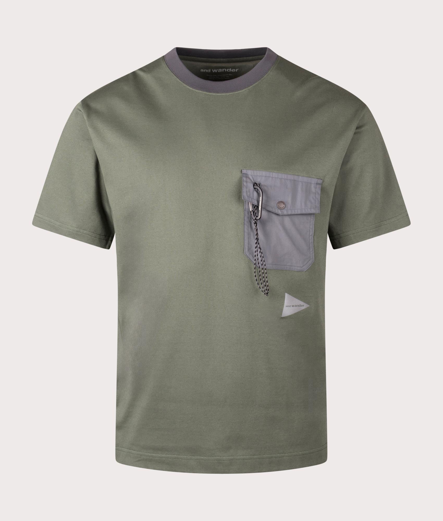 and wander Pocket T-Shirt in Sage. Shot at EQVVS.  Front detail shot 