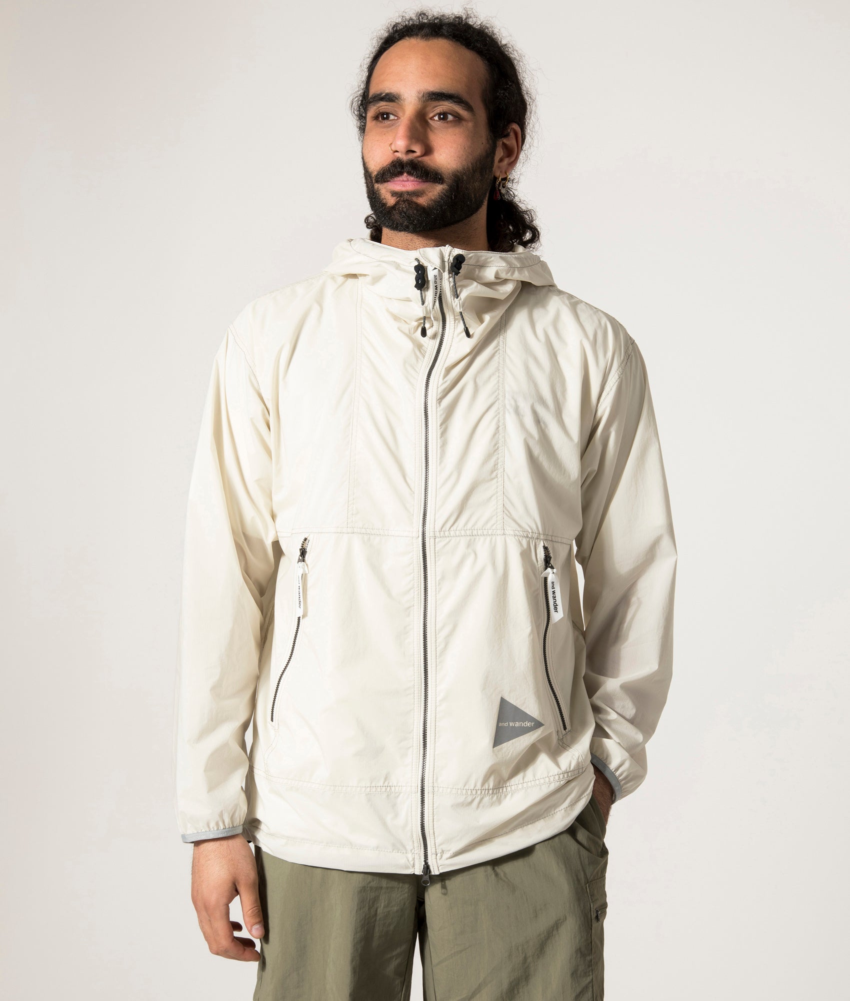and wander Pertex Wind Jacket in Off White at EQVVS. Front Model Shot.