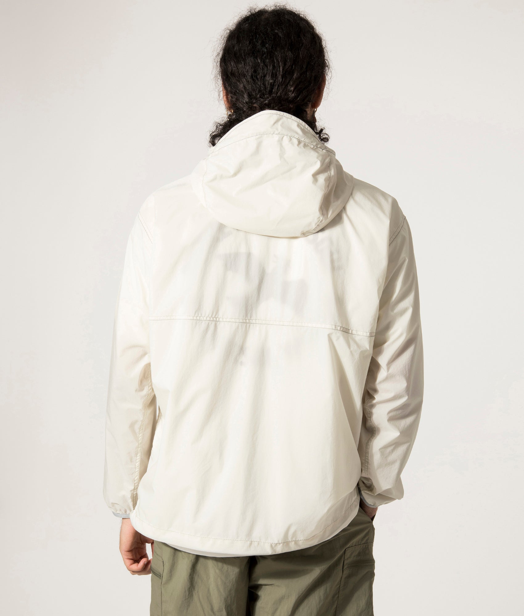 and wander Pertex Wind Jacket in Off White at EQVVS.  Back Model Shot. 