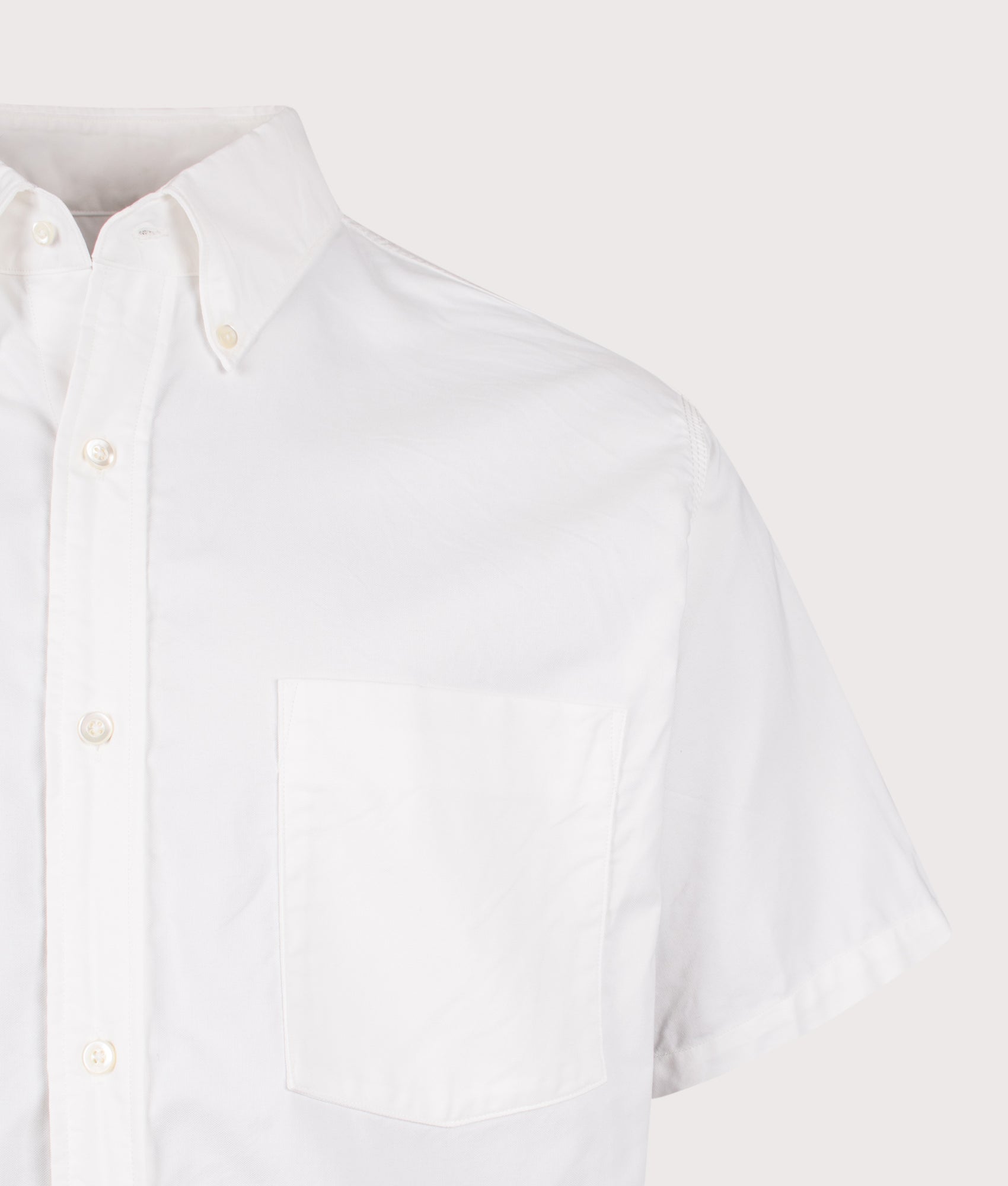 nanamica Relaxed fit Button Down Wind Short Sleeve Shirt in White at EQVVS Menswear. Detail shot.