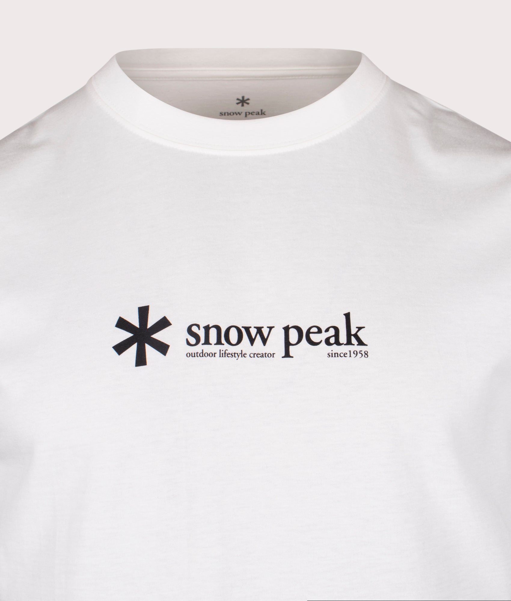 Snow Peak Soft Cotton Logo T-Shirt in white at EQVVS Menswear. Detail shot.