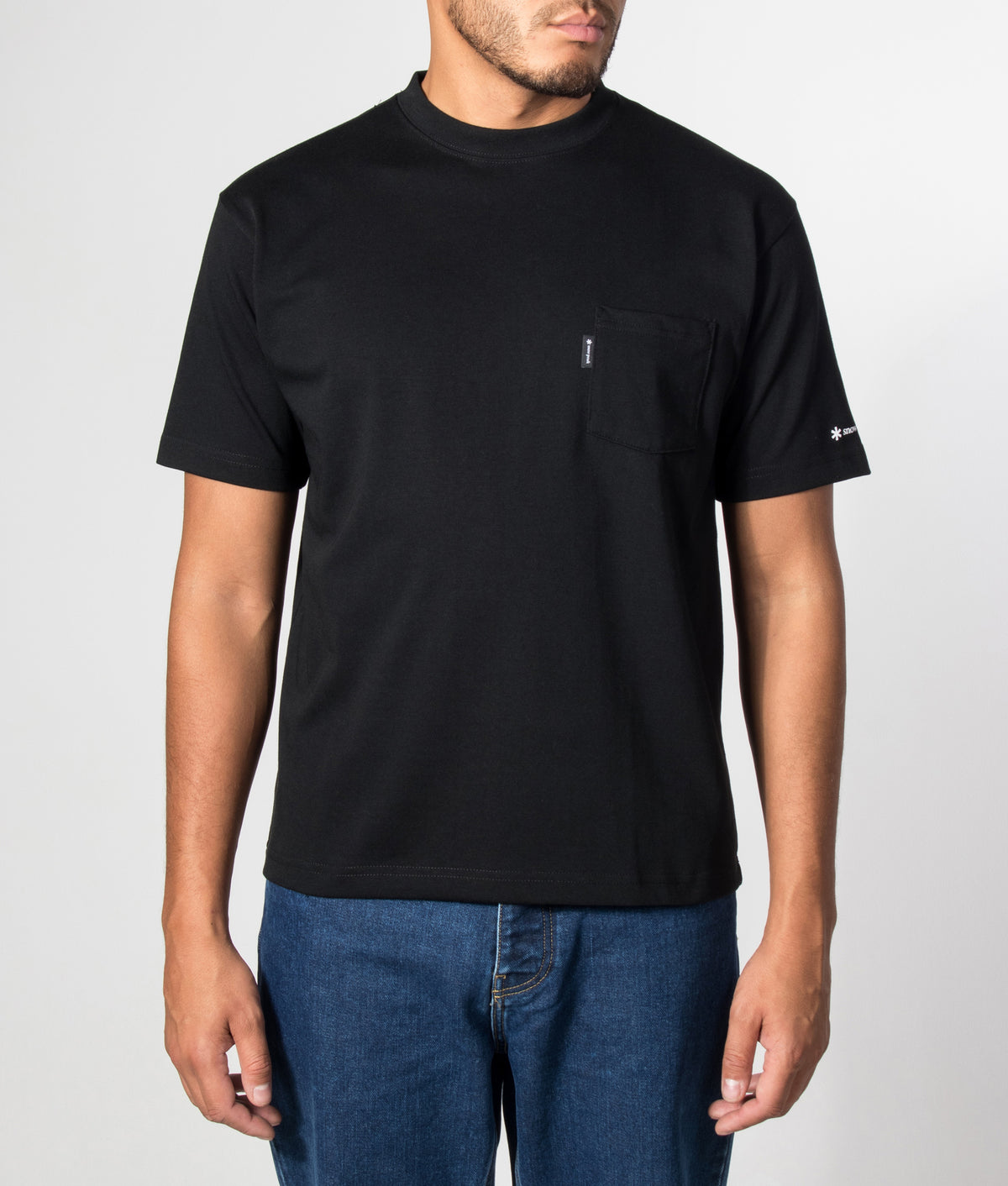 Snow Peak New Standard Pocket T-Shirt in Black at EQVVS Menswear. Model front shot.