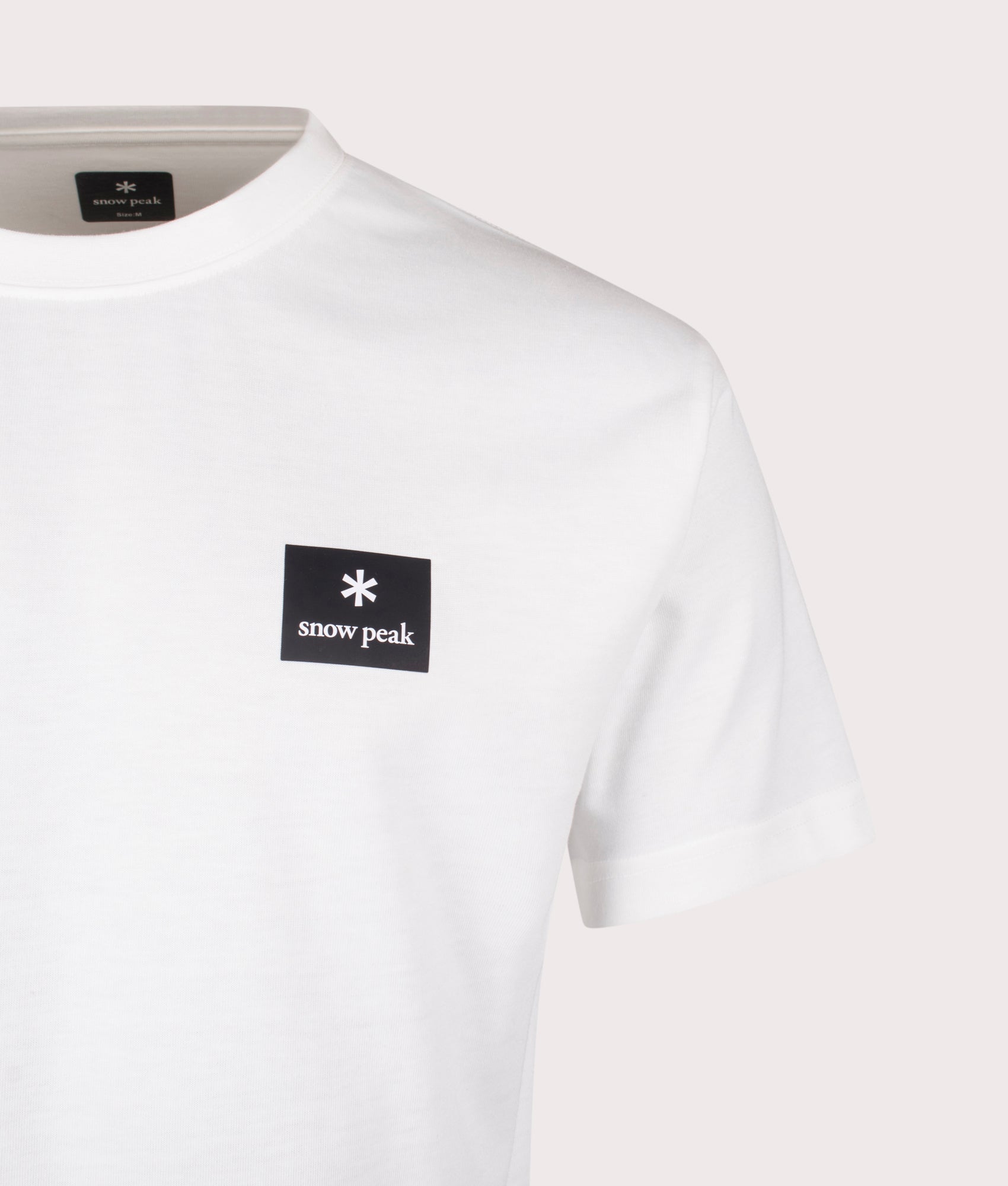 New Standard Square Logo T-Shirt in Off White. Cotton blend | Snow Peak | Shot at EQVVS | Front detail shot 