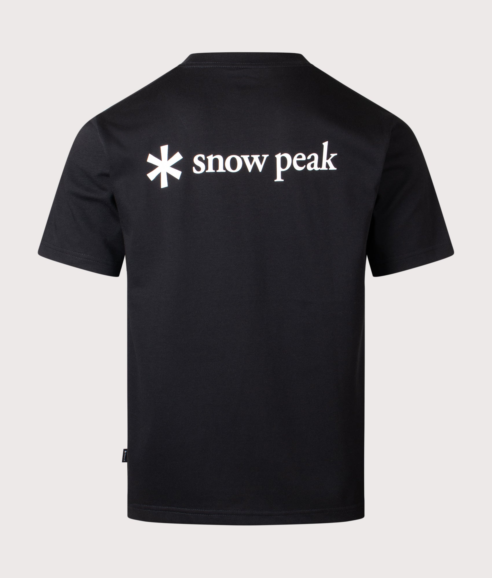 Snow Peak New Standard Back Printed Logo T-Shirt in Black at EQVVS Menswear. Front shot.