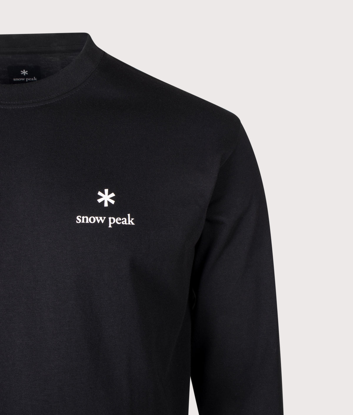 Snow Peak Regular Fit New Standard Logo Long Sleeve T-Shirt in Black at EQVVS Menswear. Detail shot.