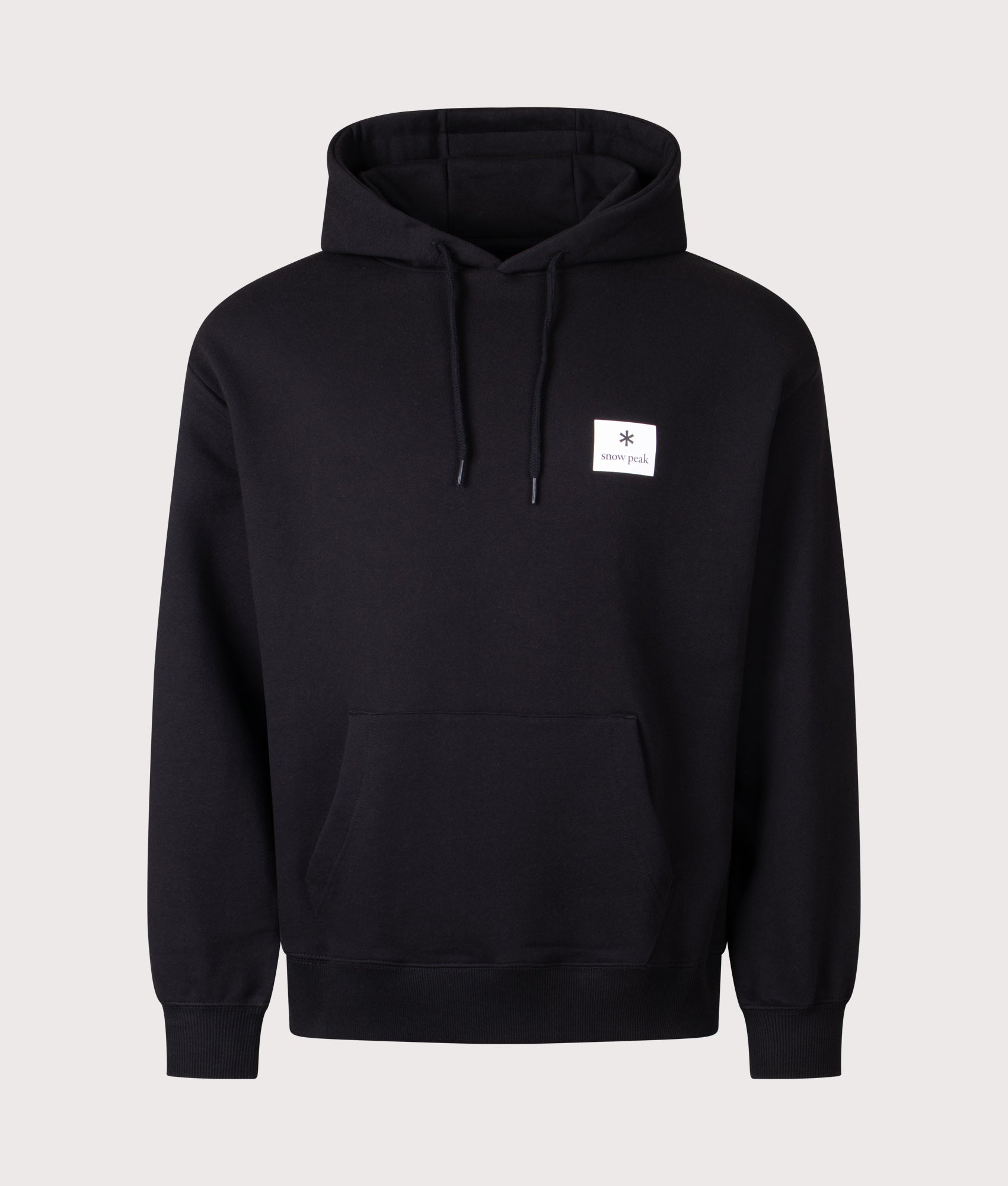 Snow Peak New Standard Square Logo Hoodie in black at EQVVS Menswear. Front shot.