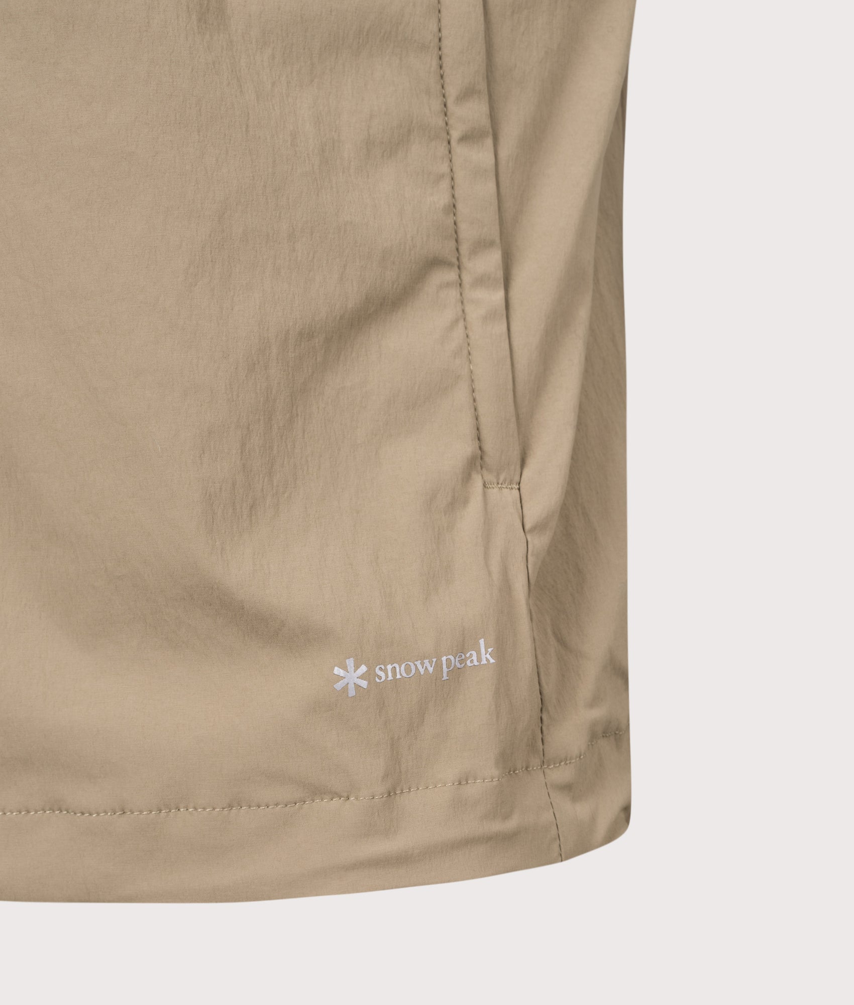 Utility Vest in Greige. | Snow Peak | Shot at EQVVS | Front hem detail shot 