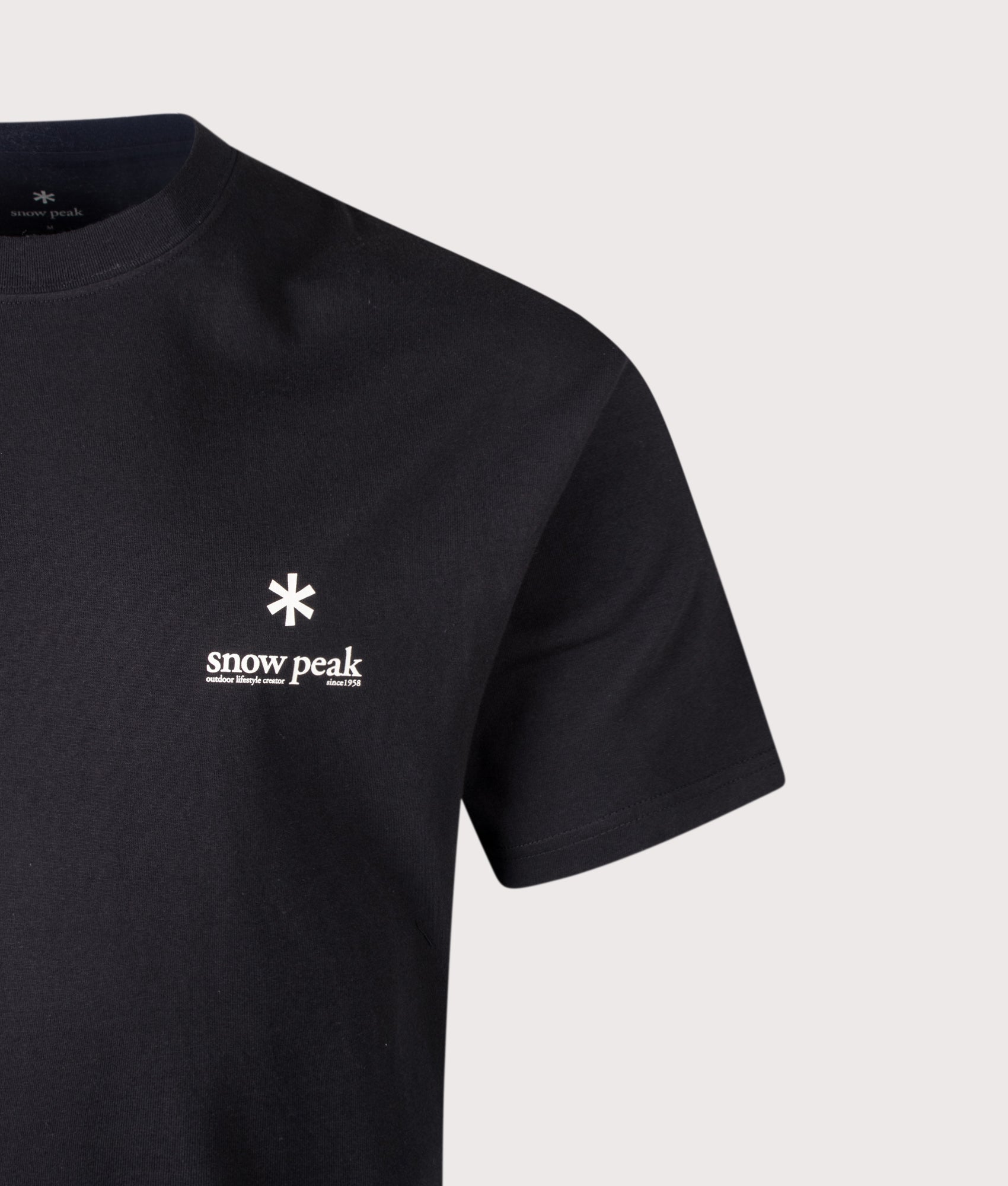 Snow Peak Relaxed Fit Soft Cotton Logo T-Shirt in Black at EQVVS Menswear. Detail shot.