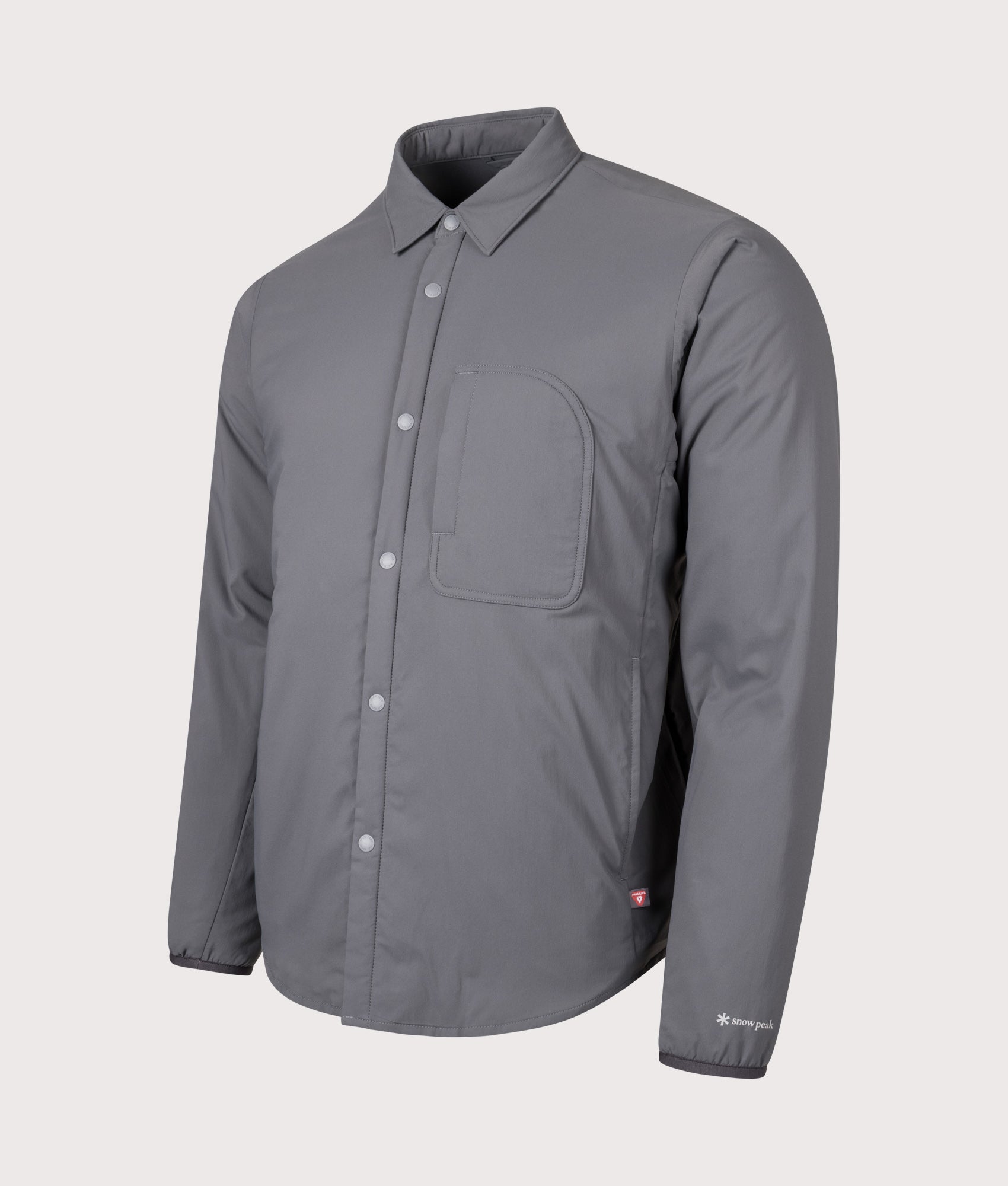 Snow peak Flexible Insulated Shirt in Charcoal at EQVVS Menswear. Angled front shot.