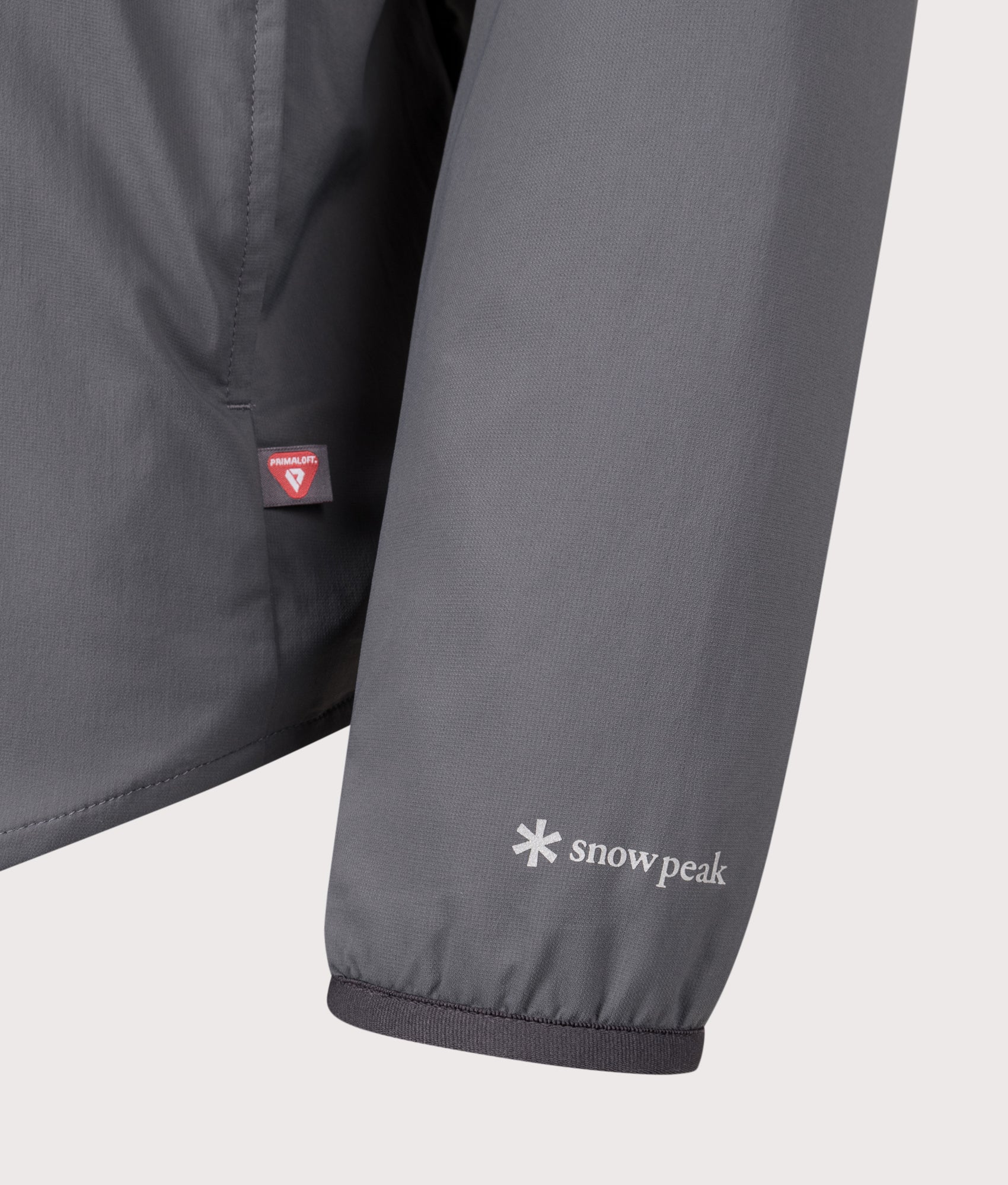 Snow peak Flexible Insulated Shirt in Charcoal at EQVVS Menswear. Detail shot.