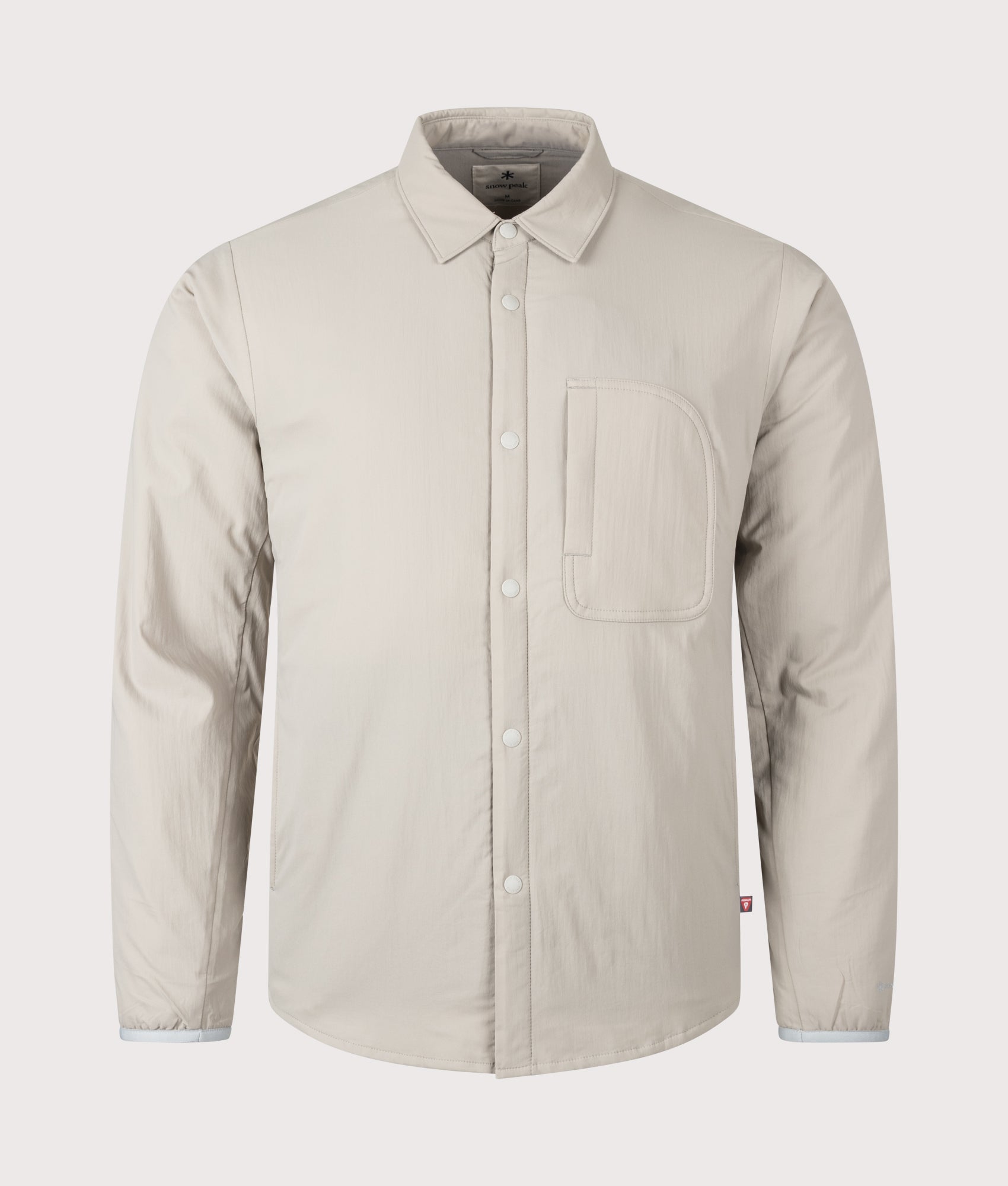 Snow Peak Flexible Insulated Shirt in Greige at EQVVS Menswear. Front shot.