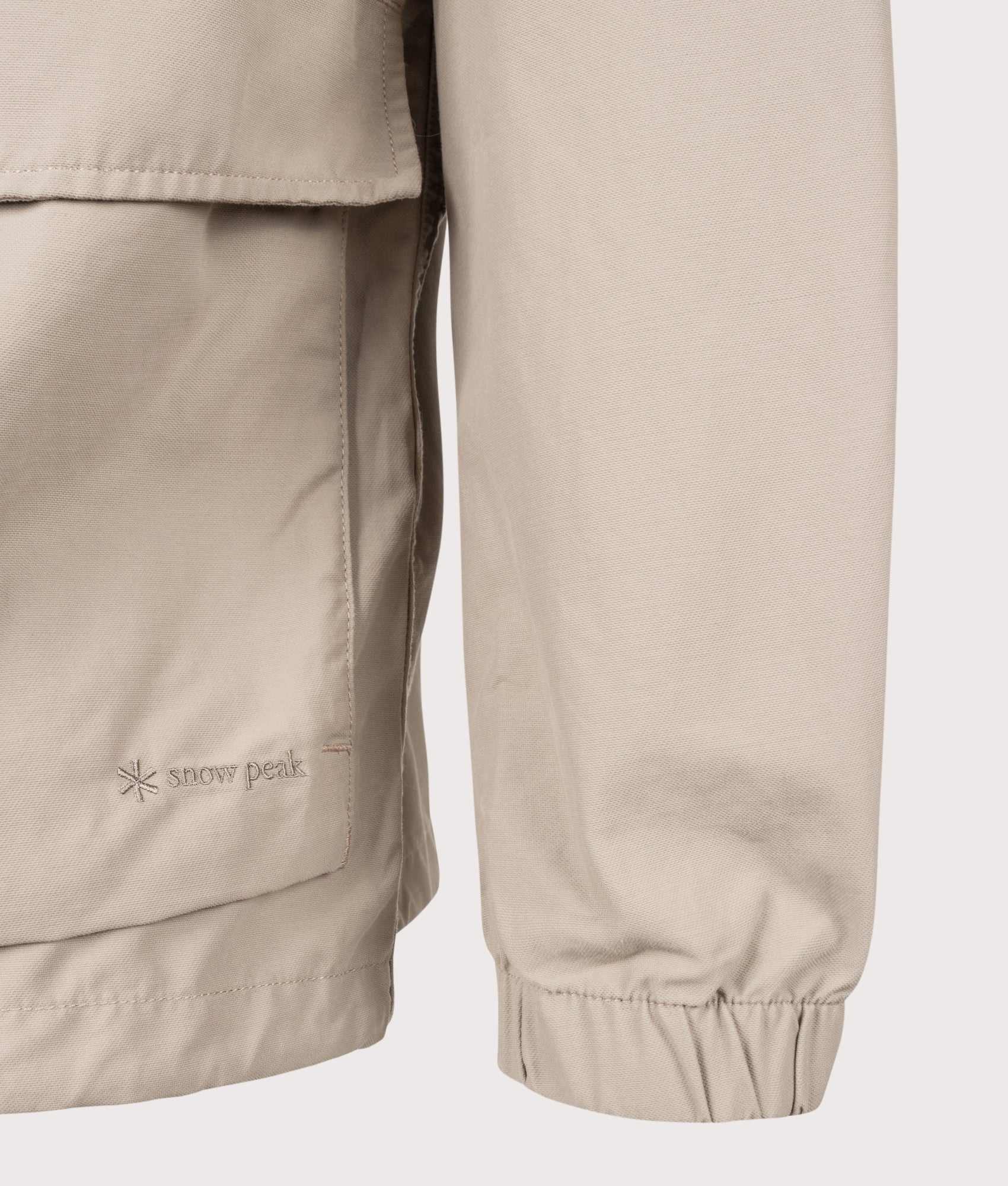 Snow Peak Light Dobby Cloth Parka in Greige at EQVVS Menswear. Detail shot.