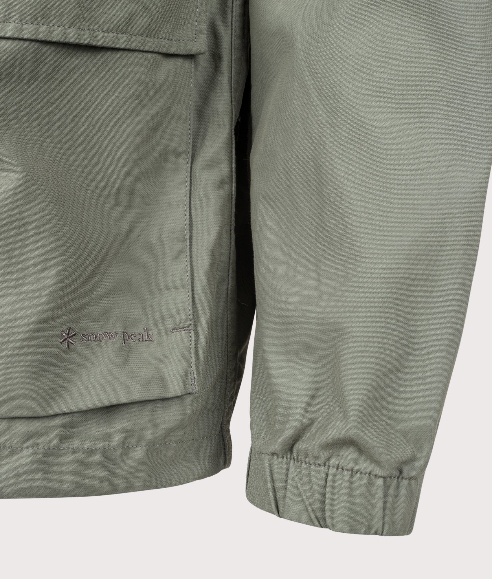Snow Peak Light Dobby Cloth Parka in Foliage at EQVVS Menswear. Detail shot.