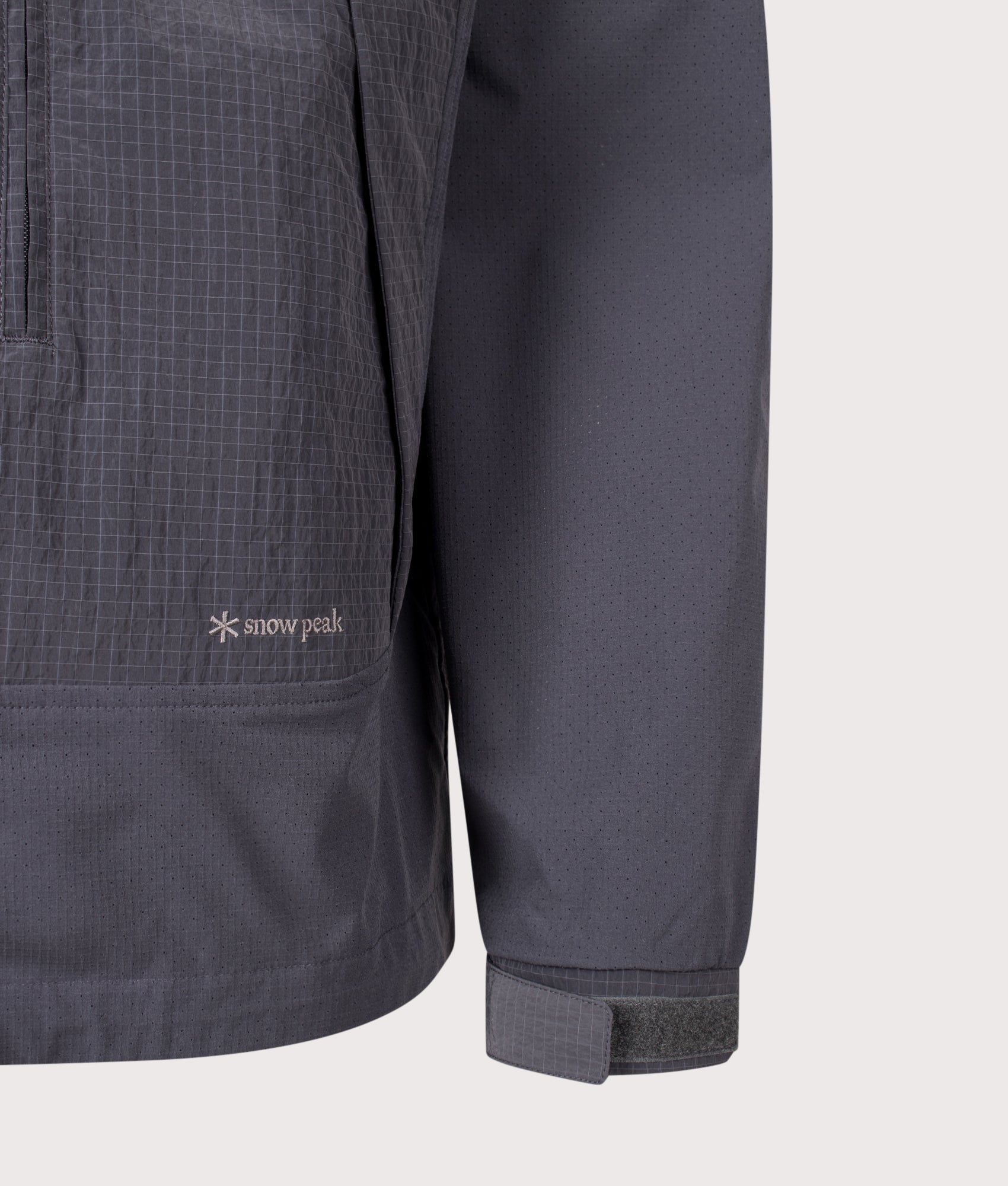 Snow Peak Relaxed Fit Insect Shield Jacket in Charcoal at EQVVS Menswear. Detail shot.