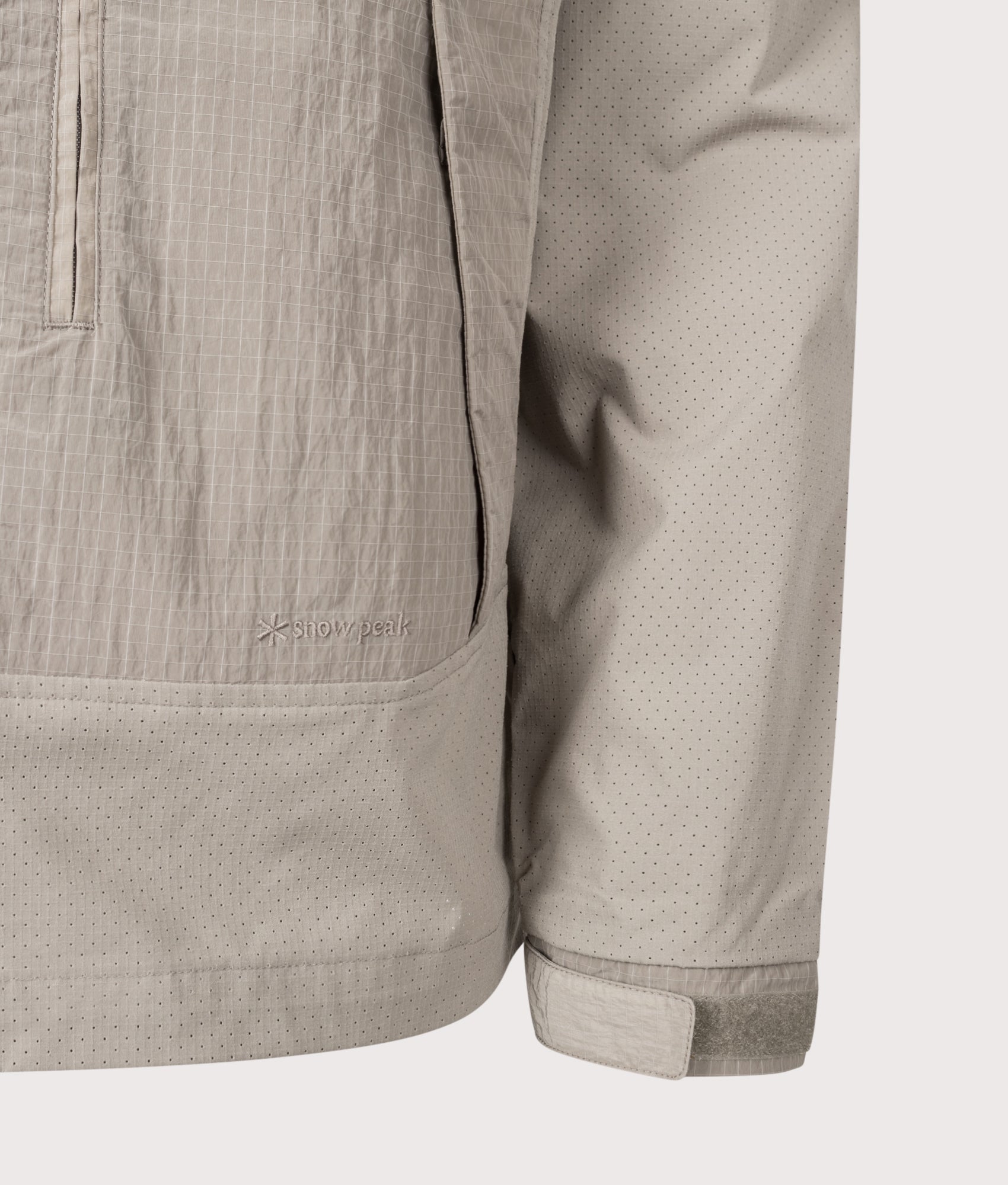Snow Peak Insect Shield Jacket in  Greige at EQVVS Menswear. Detail shot.
