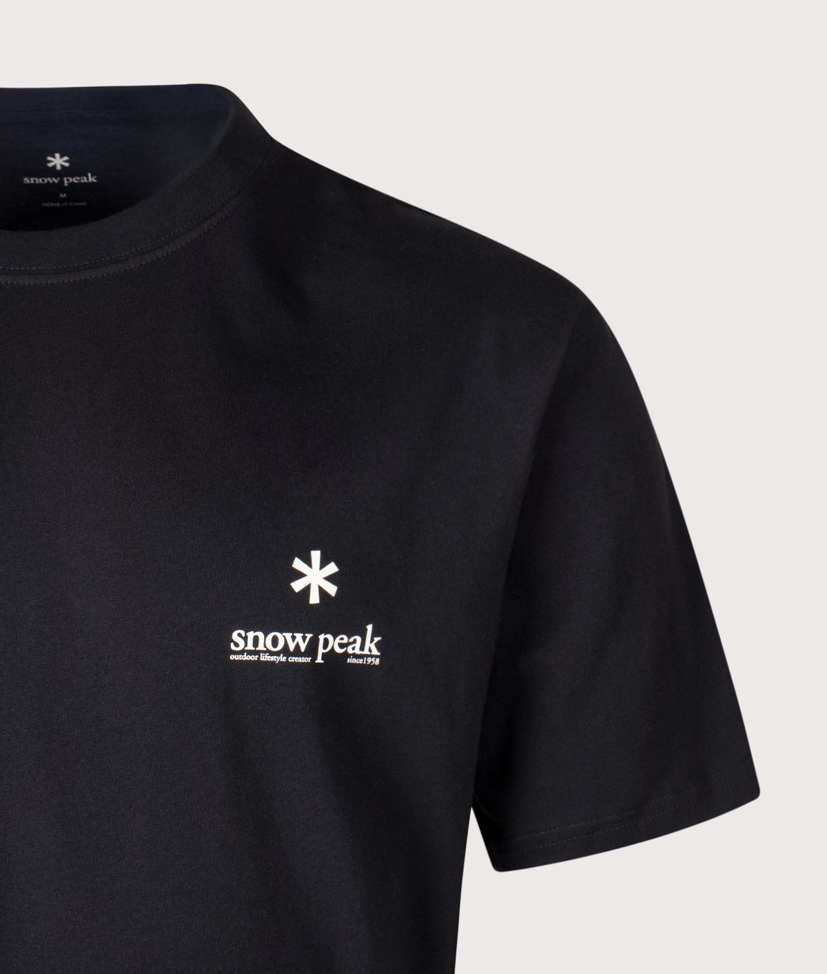 Snow Peak Relaxed Fit Soft Cotton Logo T-Shirt in Black at EQVVS Menswear. Detail shot.