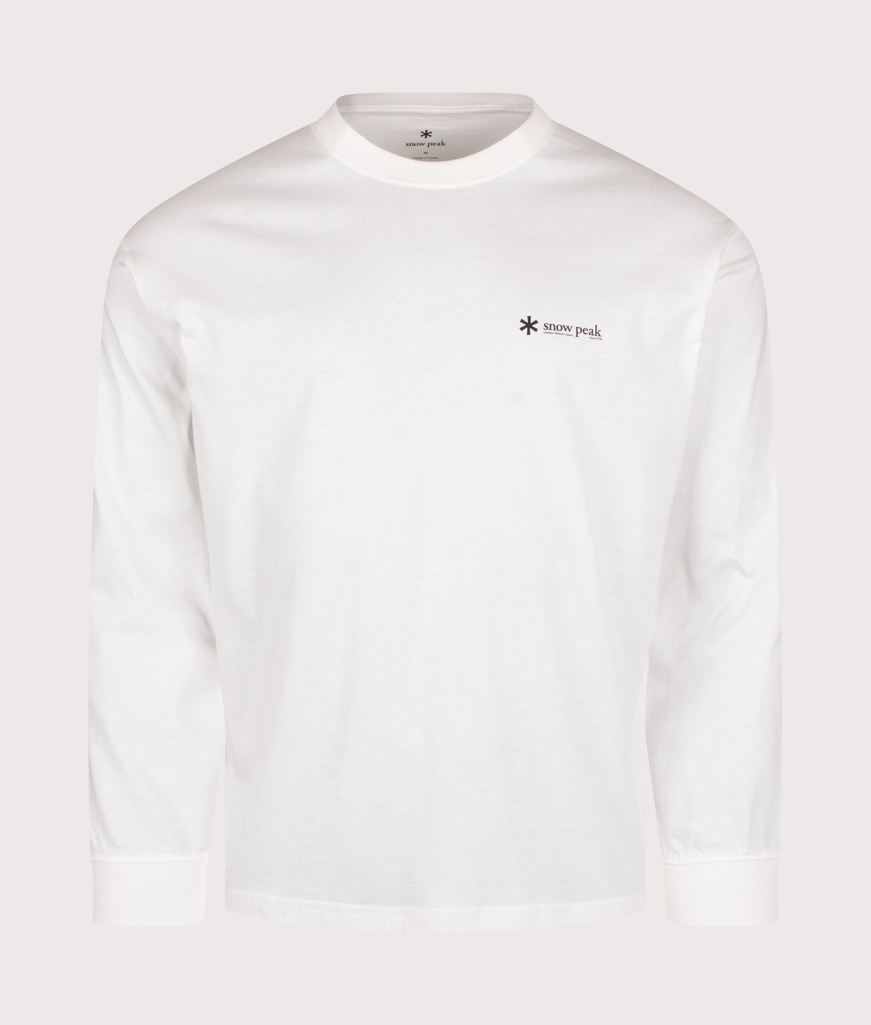 Snow Peak Relaxed Fit Long Sleeve Logo T-Shirt in Off White at EQVVS Menswear. Front shot.
