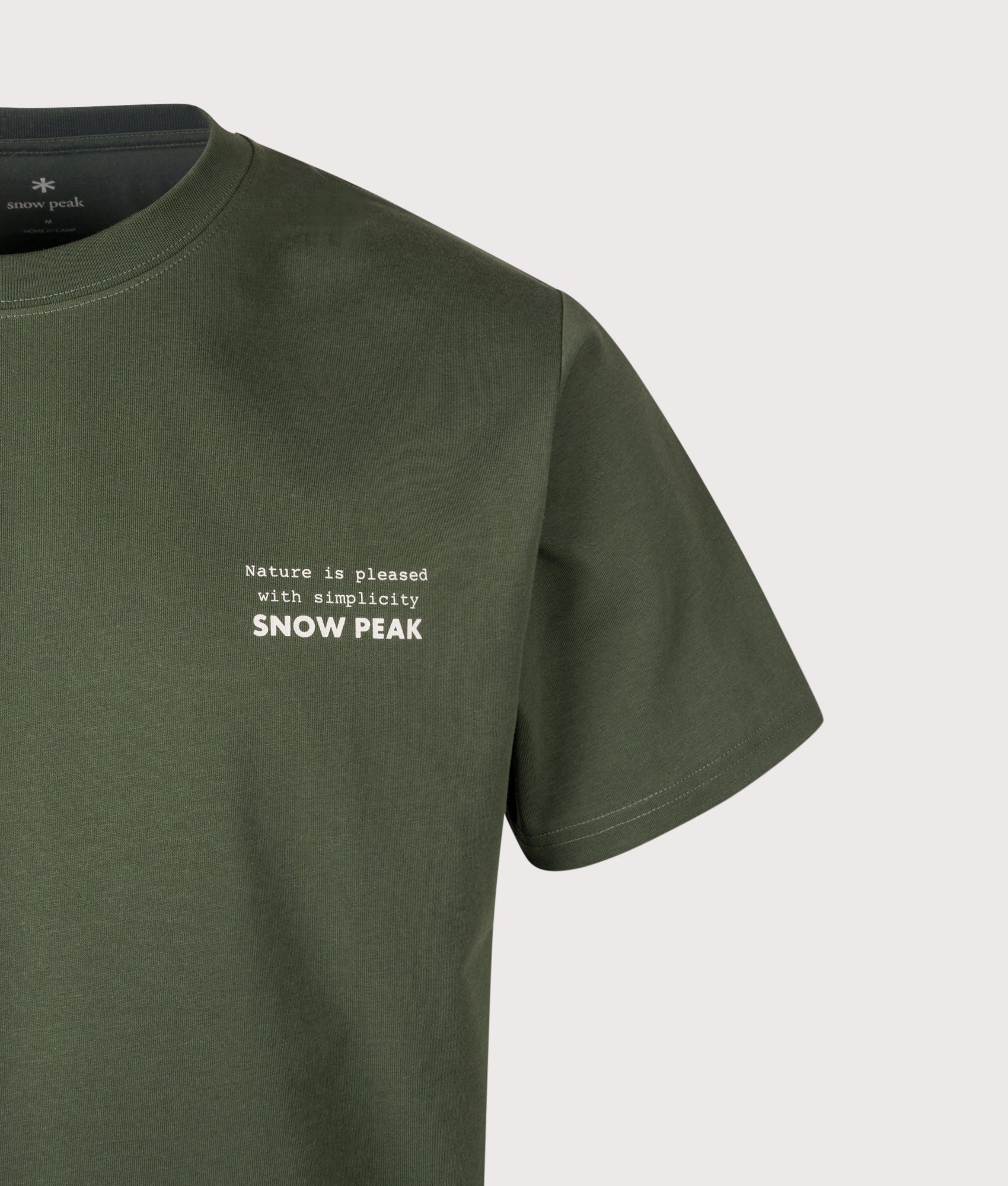 Snow Peak Relaxed Fit Elemental Balance T-Shirt in Dark Green at EQVVS Menswear. Detail shot.