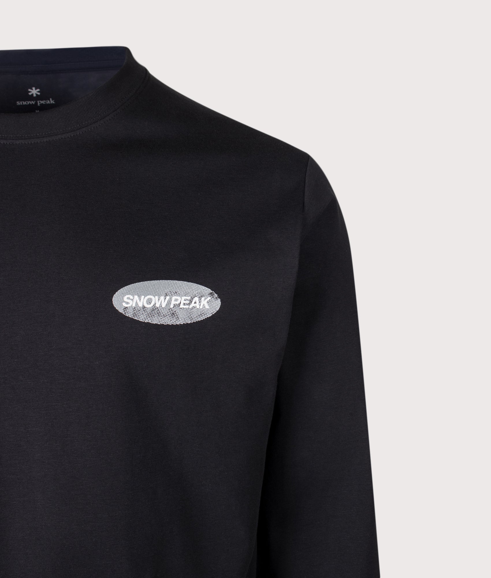 Snow Peak Relaxed Fit Campscape Long Sleeve T-Shirt in Black at EQVVS Menswear. Detail shot.