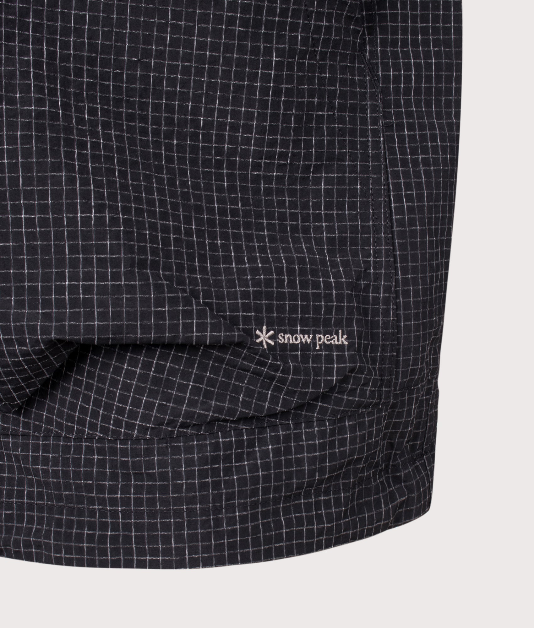 Snow Peak KASURI Ripstop Jacket in Black at EQVVS Menswear. Detail shot.