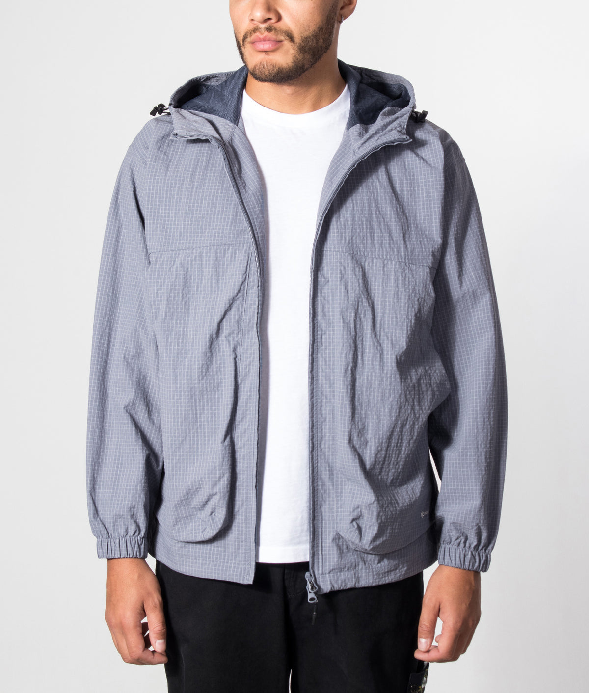 Snow Peak KASURI Ripstop Jacket in Light Blue at EQVVS Menswear. Model front shot.