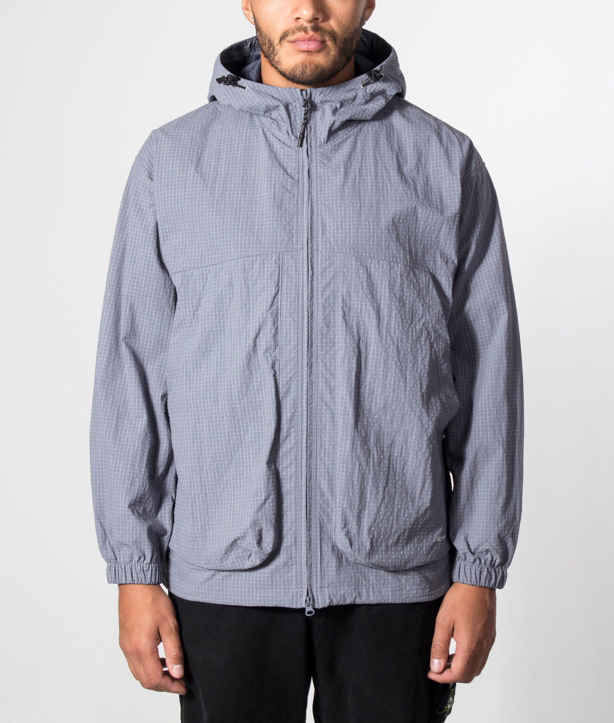 Snow Peak KASURI Ripstop Jacket in Light Blue at EQVVS Menswear. Model front shot.